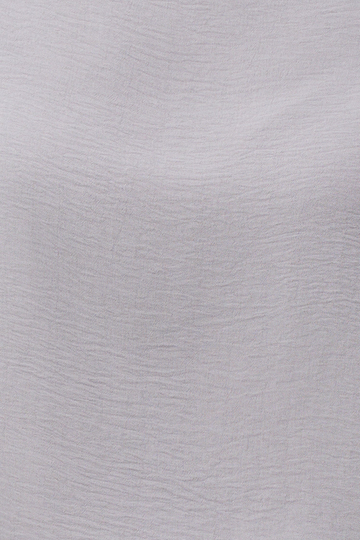 Women’s woven long sleeve v-neck top with a boat-neckline