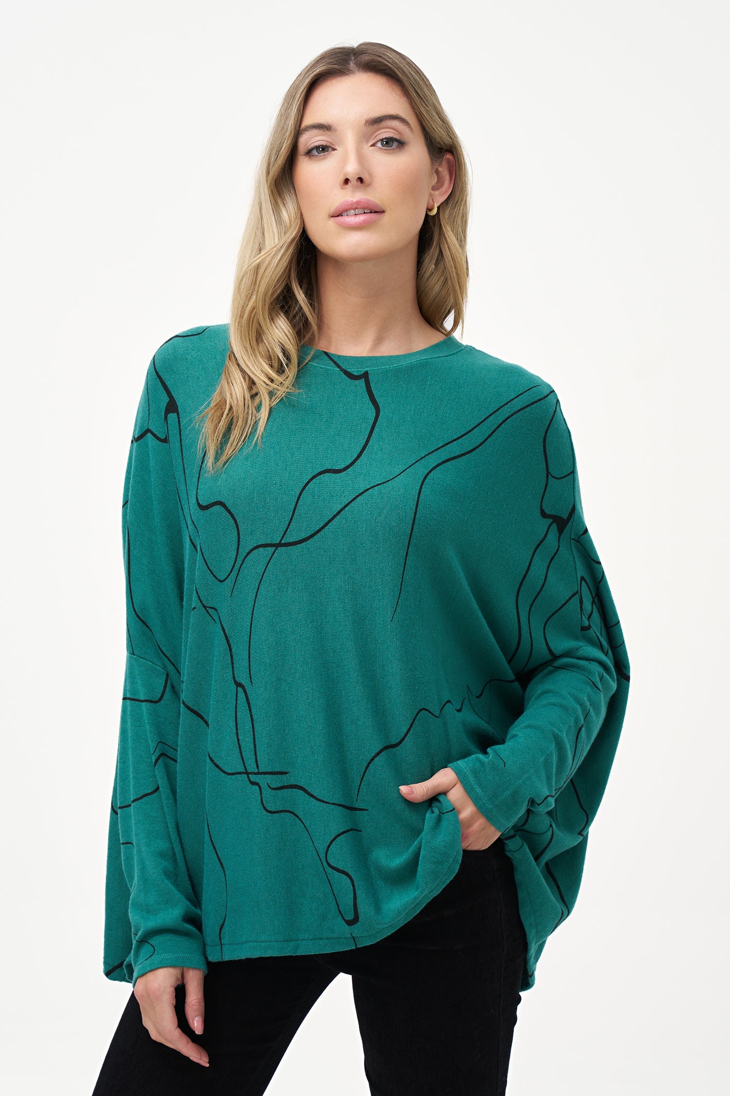 Women's knit long sleeve oversized  top, with a wide crew-neckline and a dropped shoulder