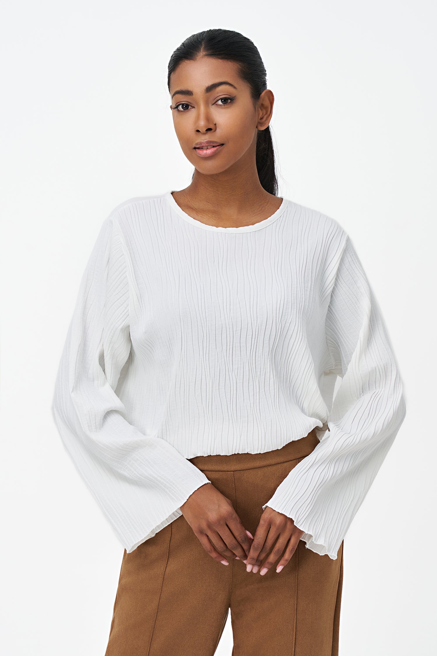 Women's woven crew-neck long sleeve top, with a button closure and key-hole detail at the back neckline (textured front and sleeves & untextured at back)