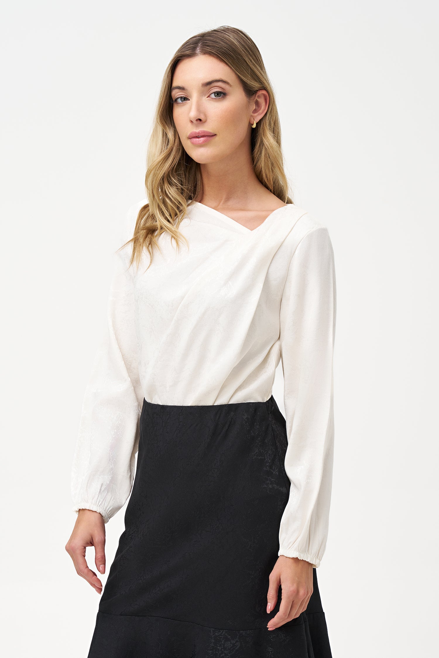 Women’s woven long sleeve top, with an asymmetrical collar