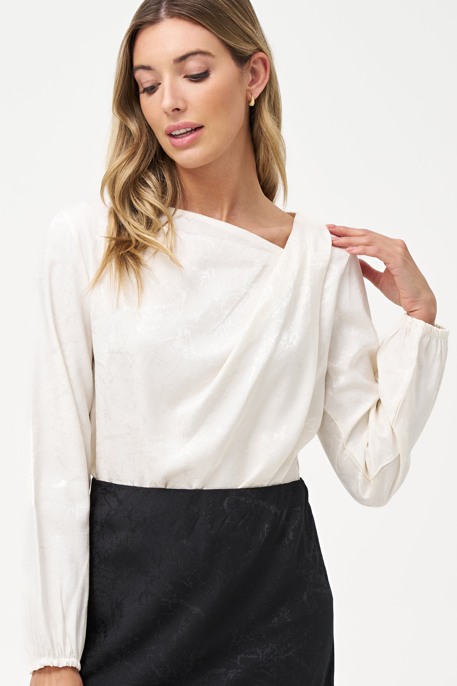 Women’s woven long sleeve top, with an asymmetrical collar
