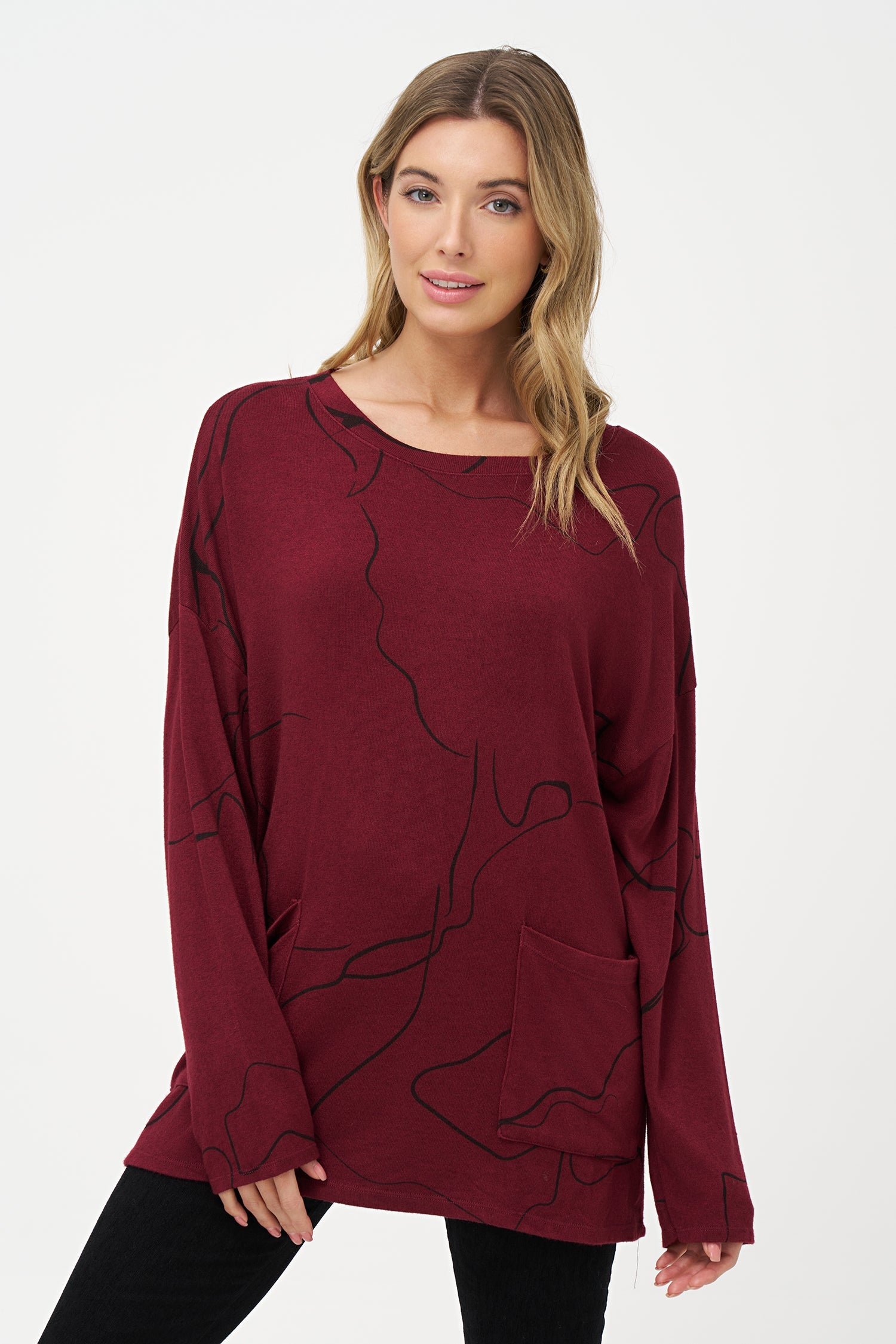 Women's knit wide neck tunic, with patch pockets and long sleeves with a dropped shoulder
