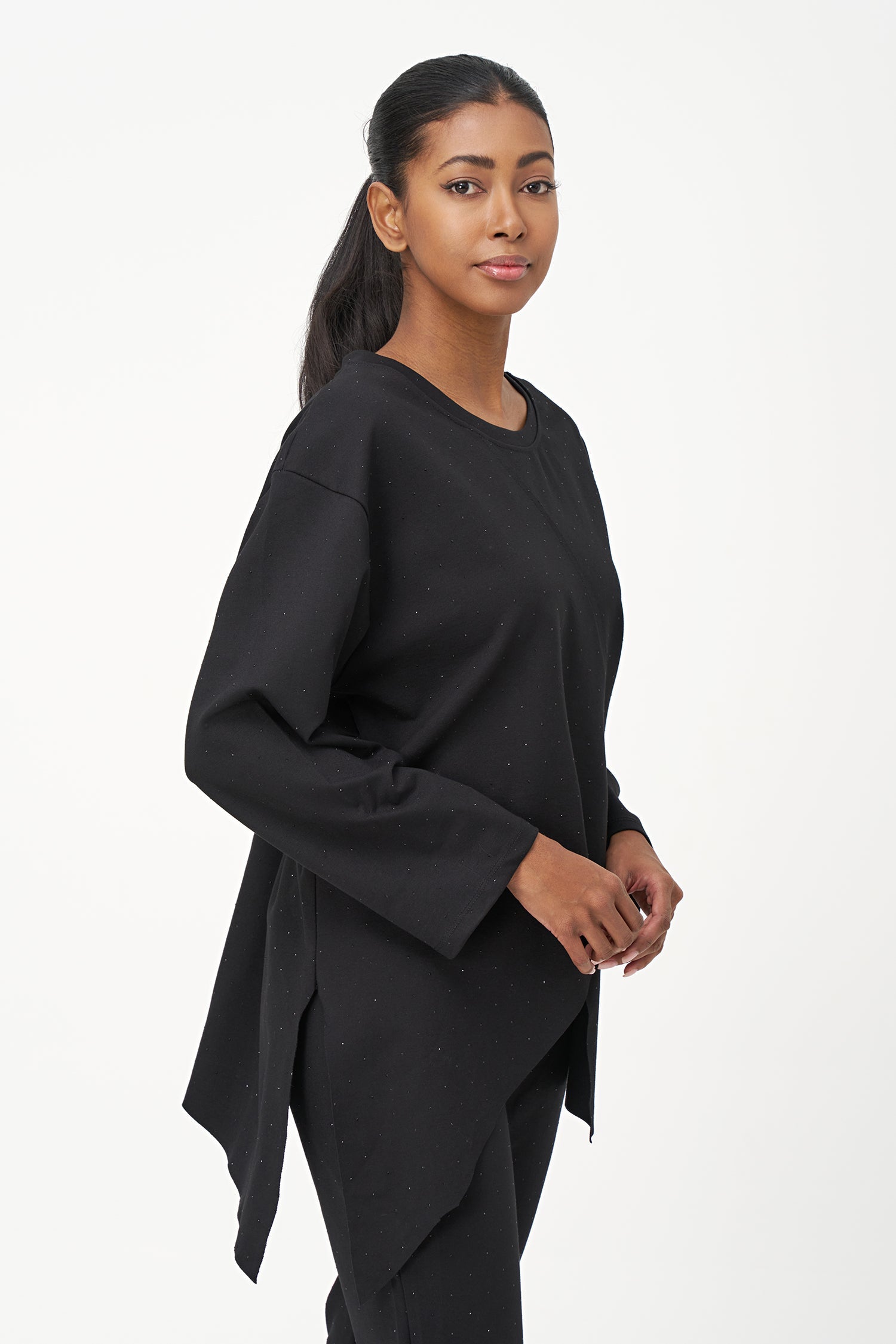 Women's knit crew-neck long-sleeve tunic, with decorative studs and an asymmetrical hemline