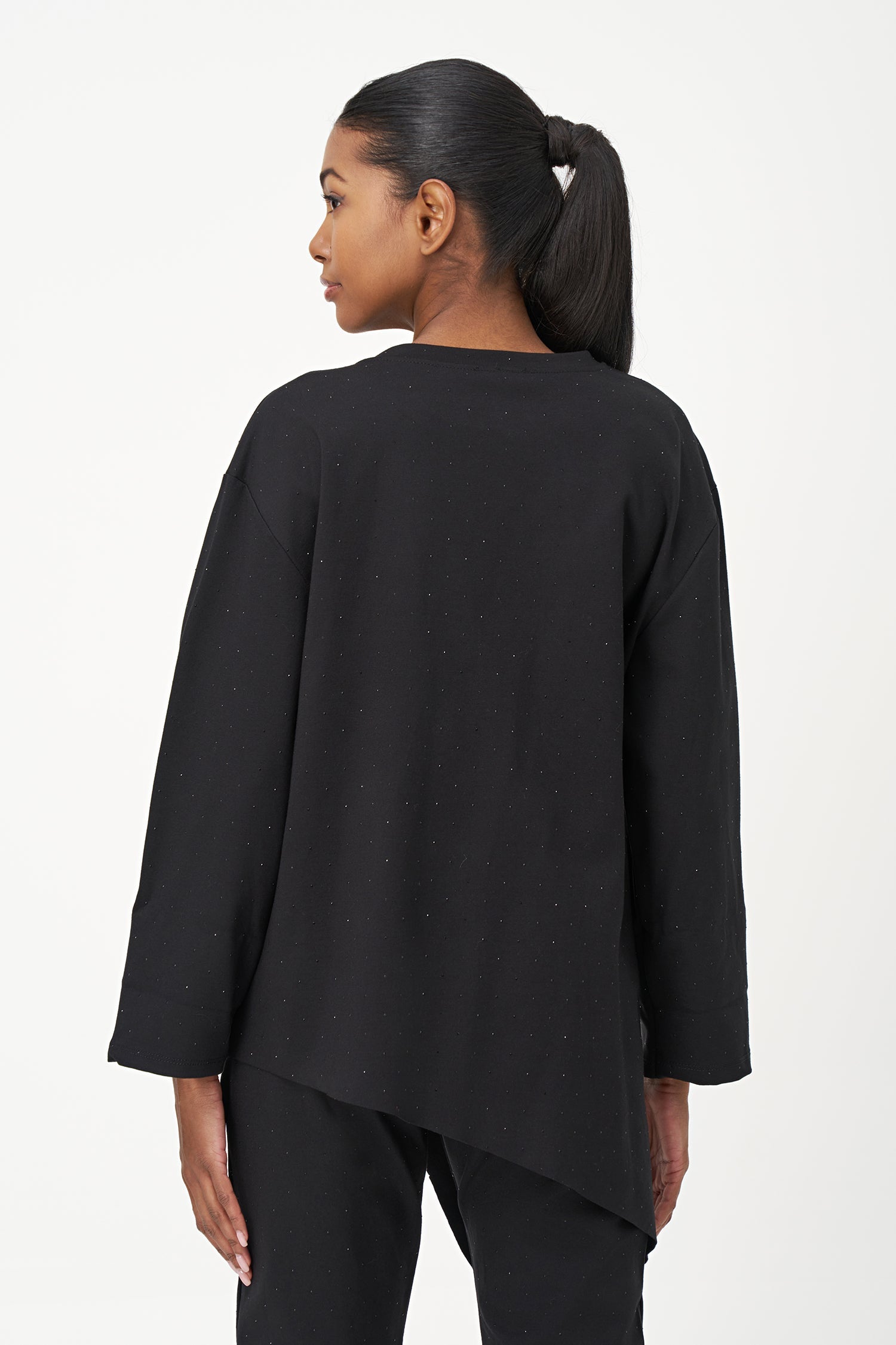Women's knit crew-neck long-sleeve tunic, with decorative studs and an asymmetrical hemline