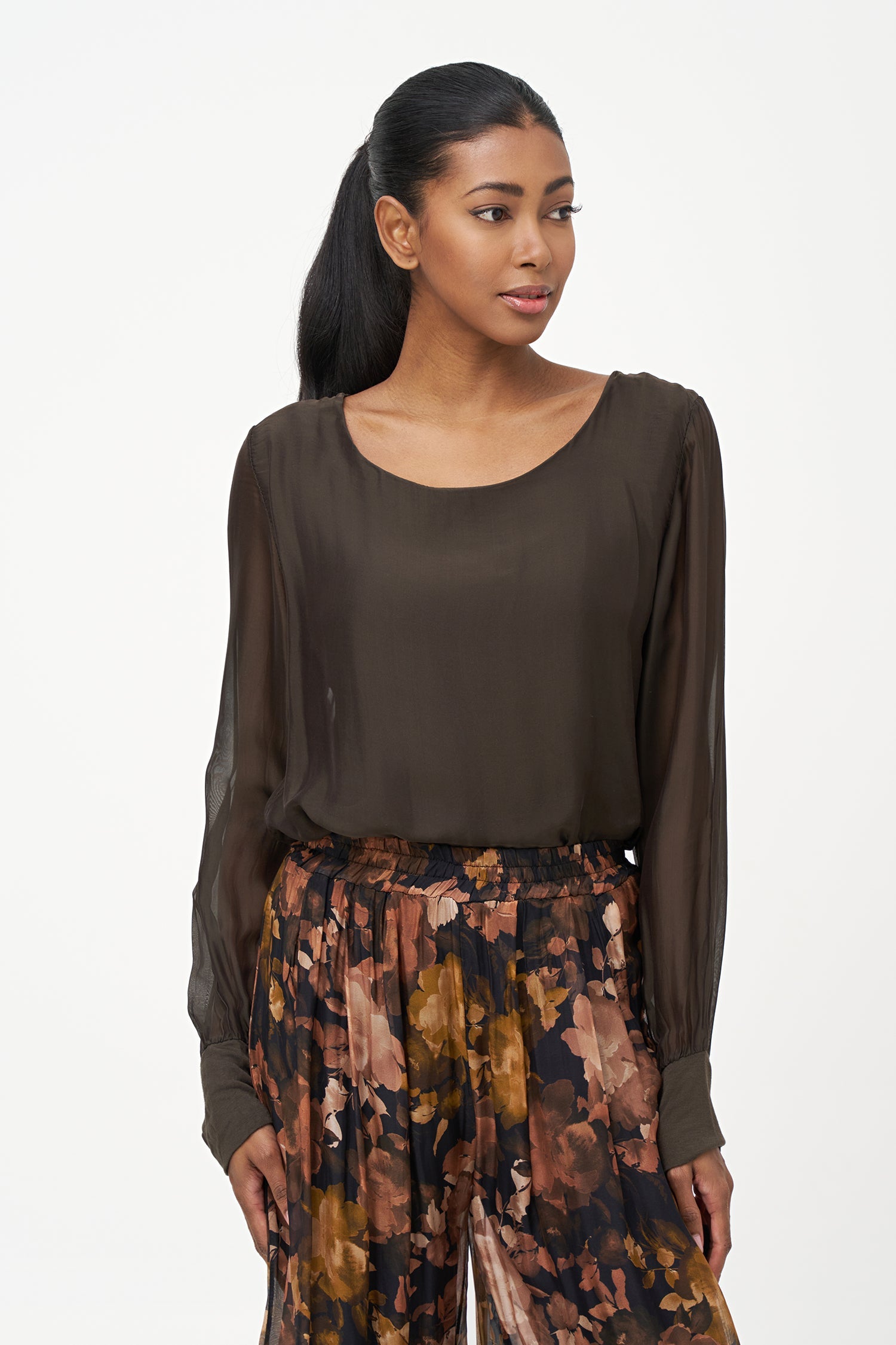 Women's woven long sleeve crew-neck top with cuffs