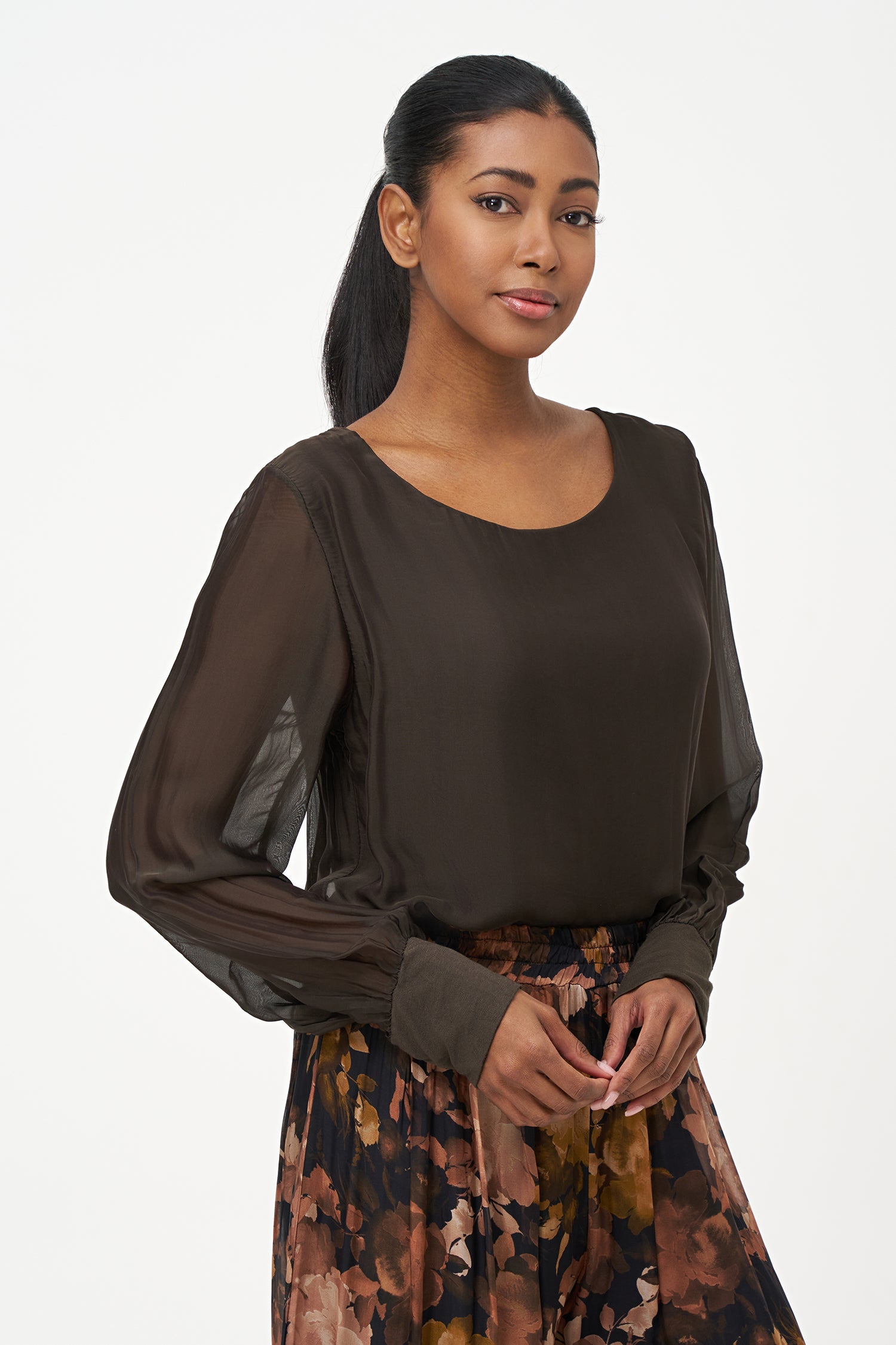 Women's woven long sleeve crew-neck top with cuffs