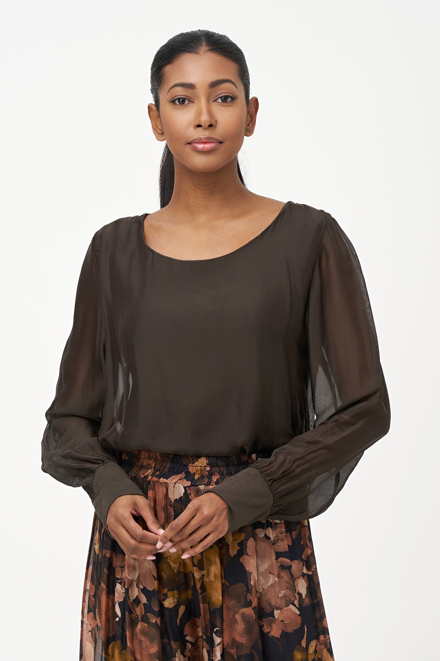 Women's woven long sleeve crew-neck top with cuffs