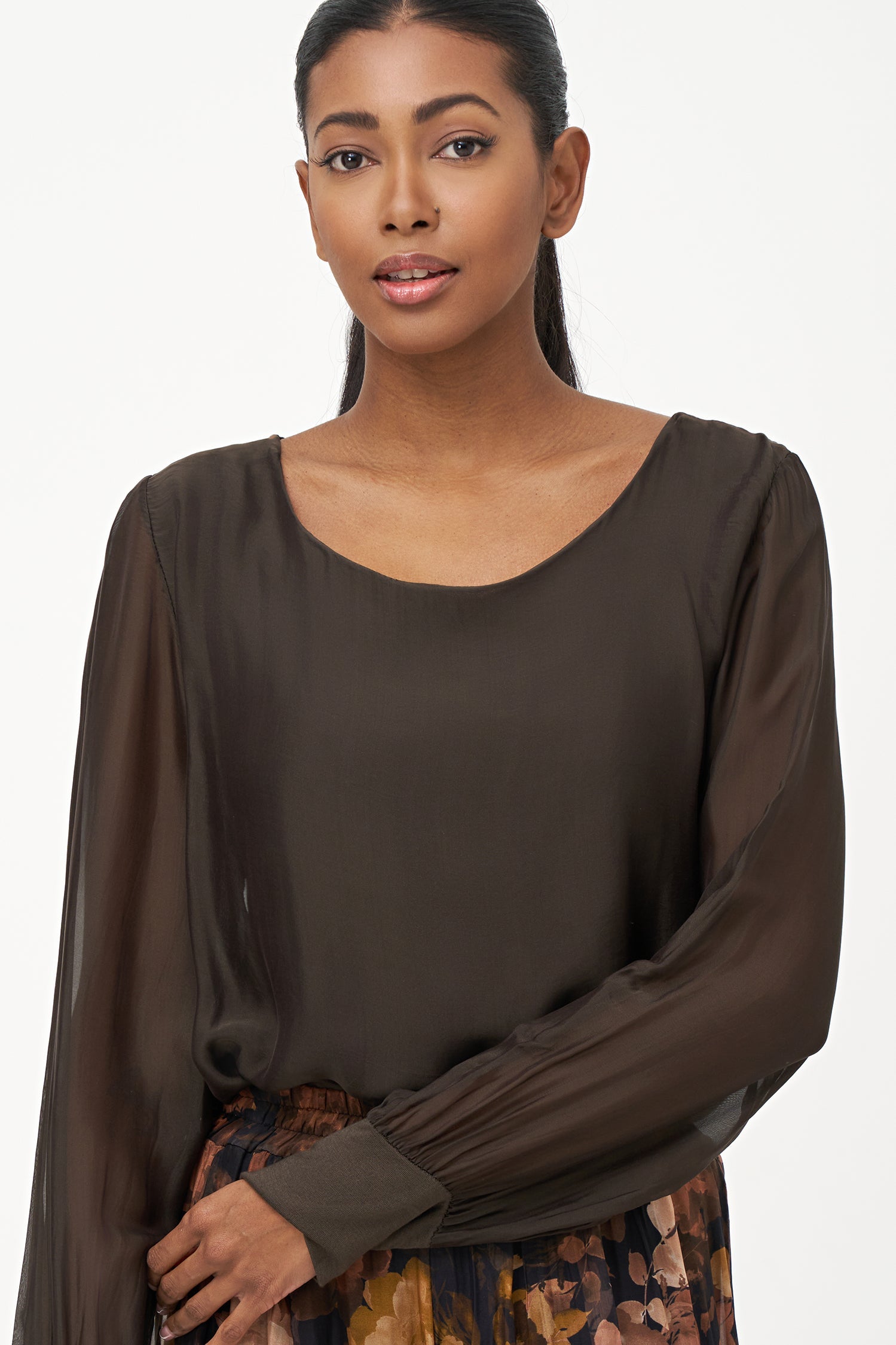 Women's woven long sleeve crew-neck top with cuffs