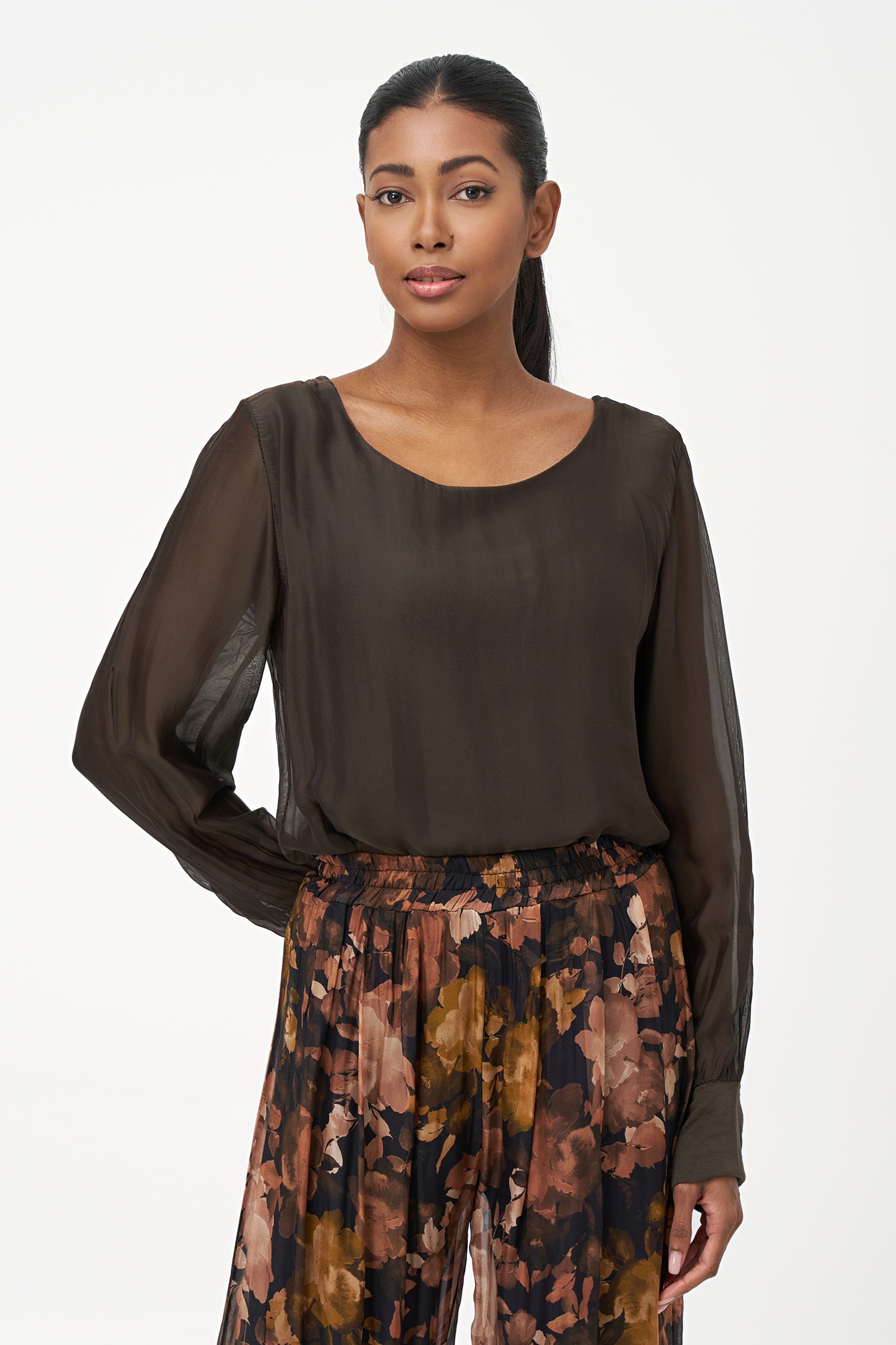 Women's woven long sleeve crew-neck top with cuffs