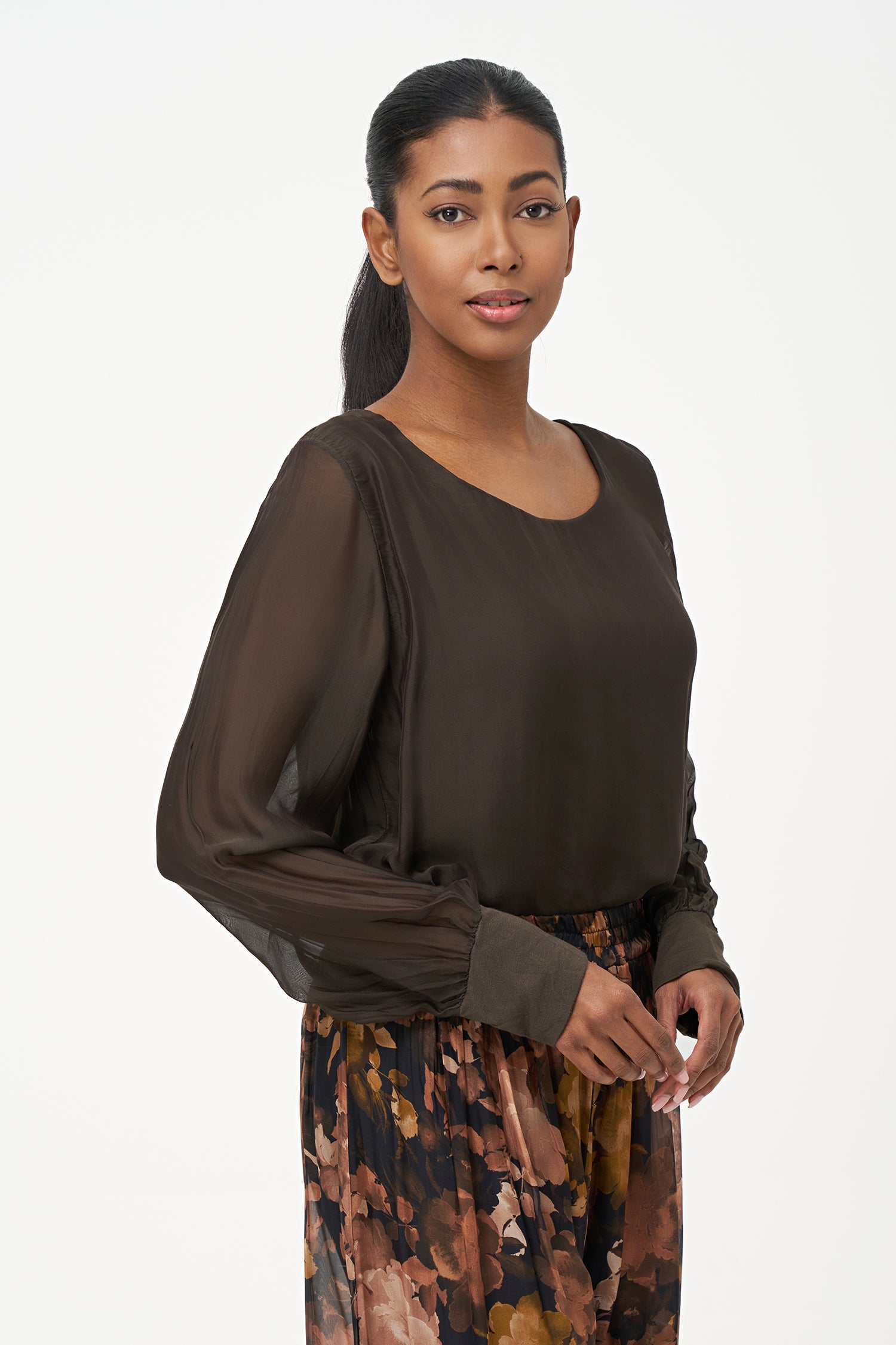 Women's woven long sleeve crew-neck top with cuffs