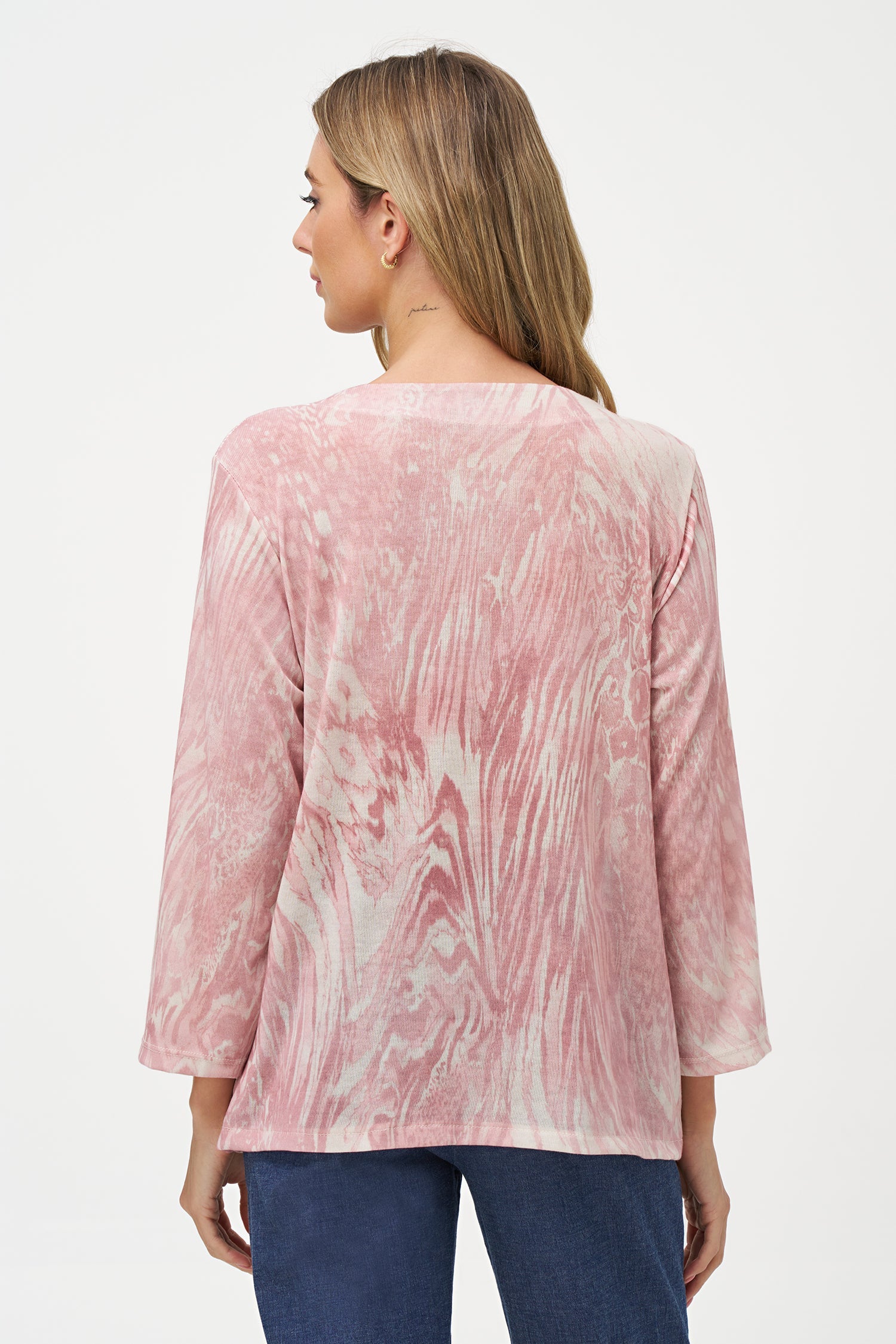 Women's knit wide crew-neckline  tunic, with long sleeves and a twisted front hemline