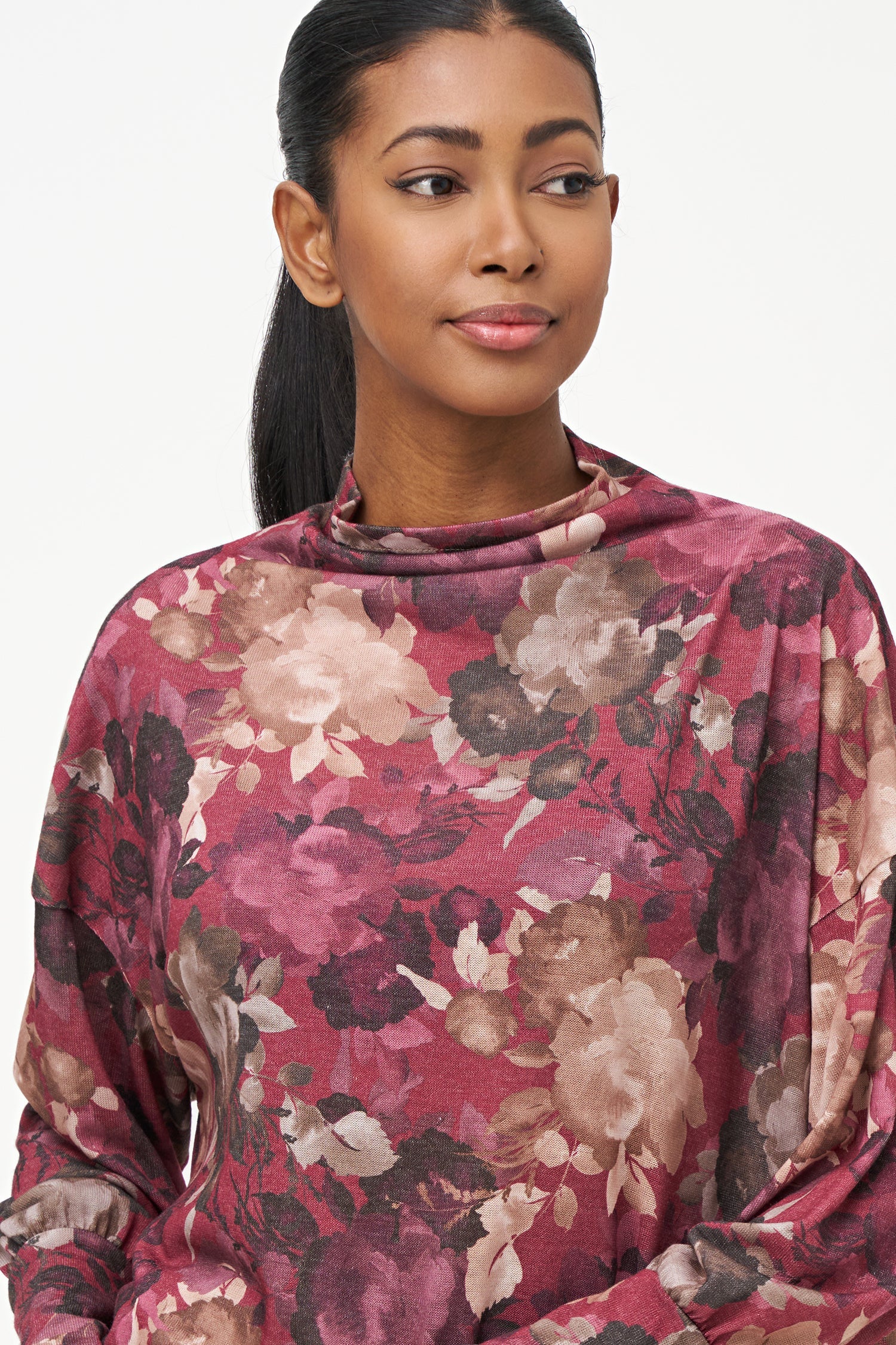 Women's knit long sleeve  tunic, with a cowl turtle-neck collar, and a high/low hemline with side seam slits