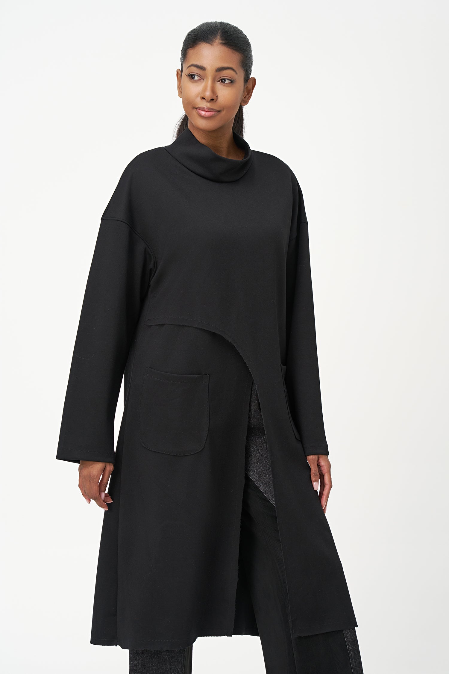 Women’s knit mock-neck tunic, with long sleeves, patch pockets and a front slit opening