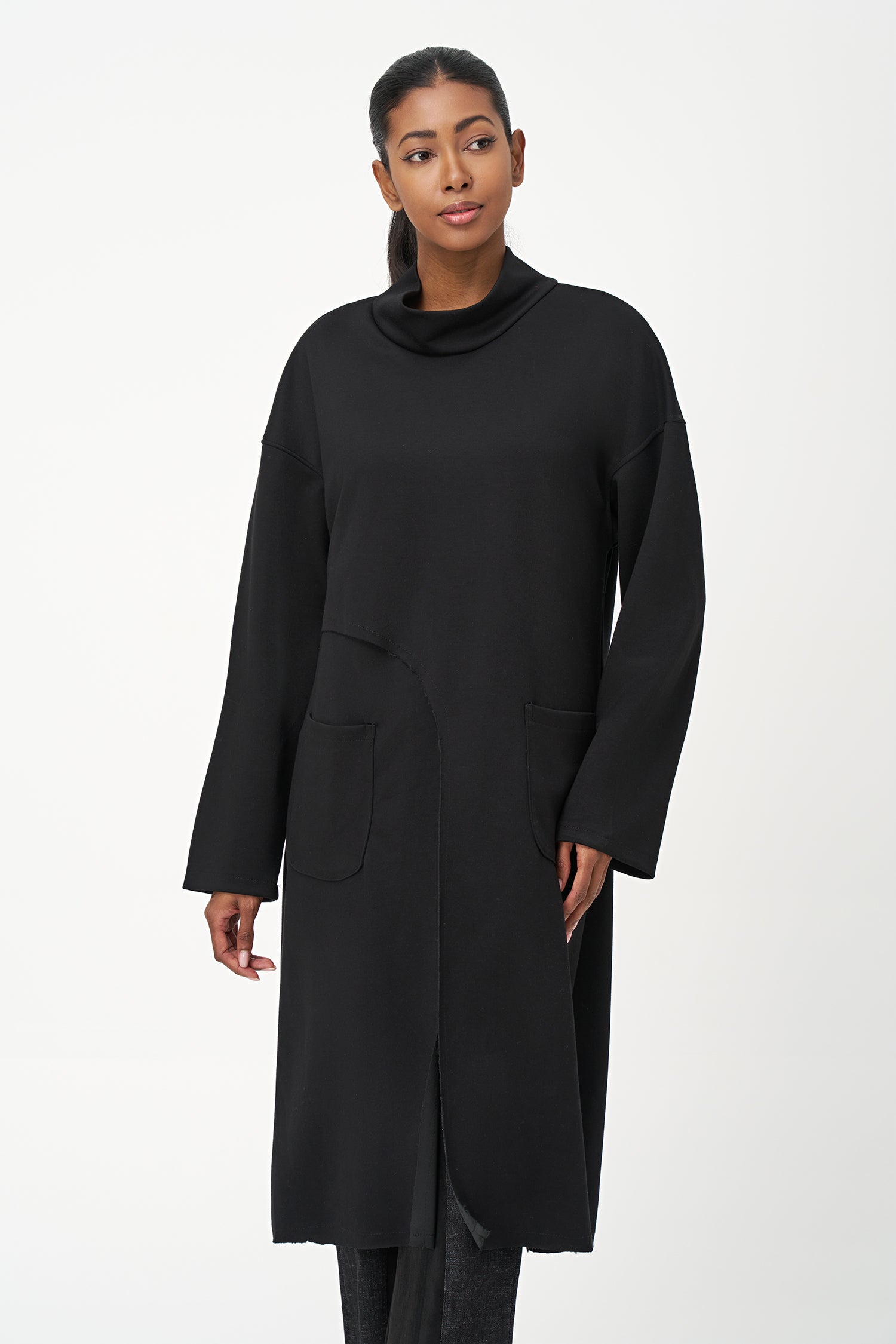 Women’s knit mock-neck tunic, with long sleeves, patch pockets and a front slit opening