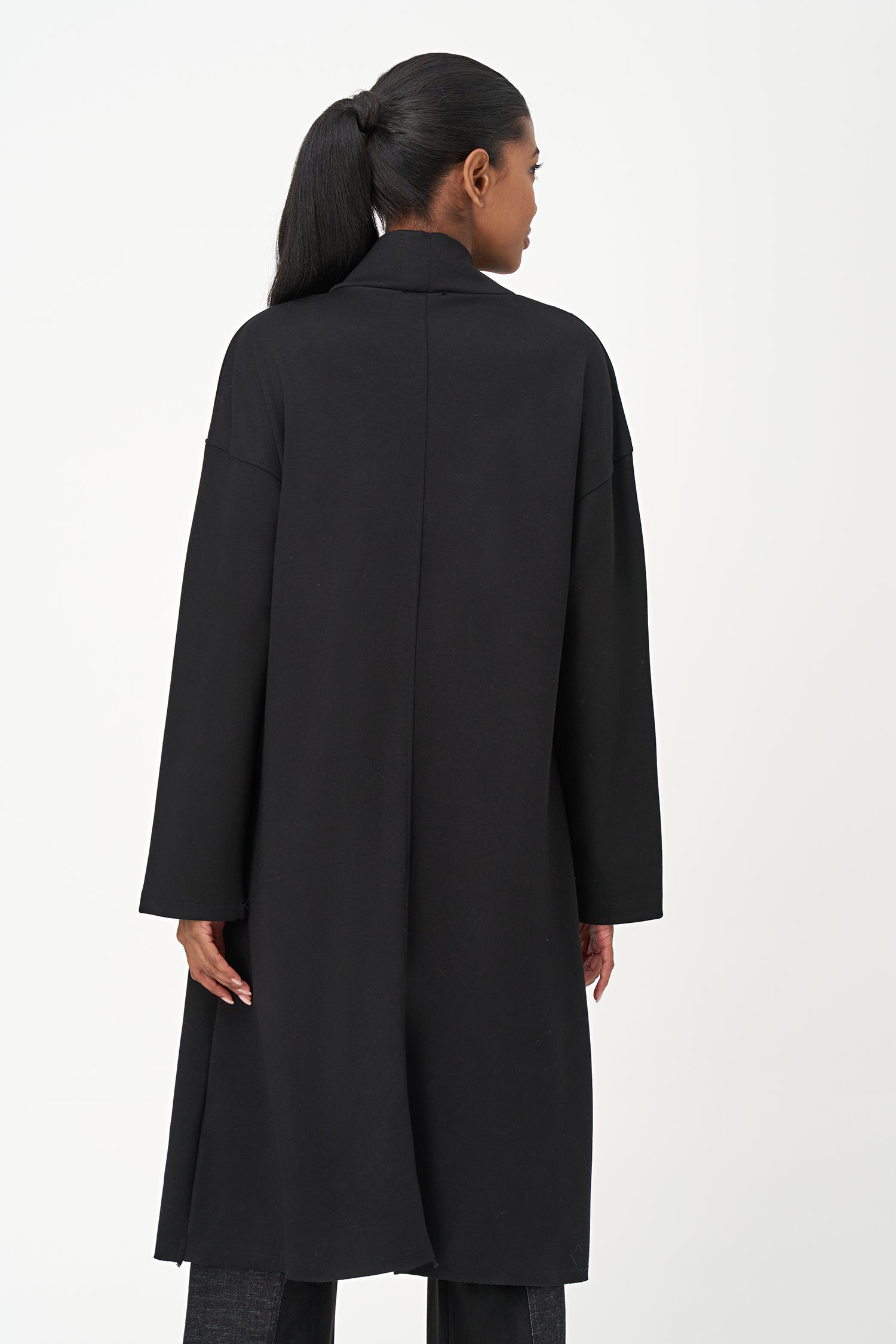 Women’s knit mock-neck tunic, with long sleeves, patch pockets and a front slit opening