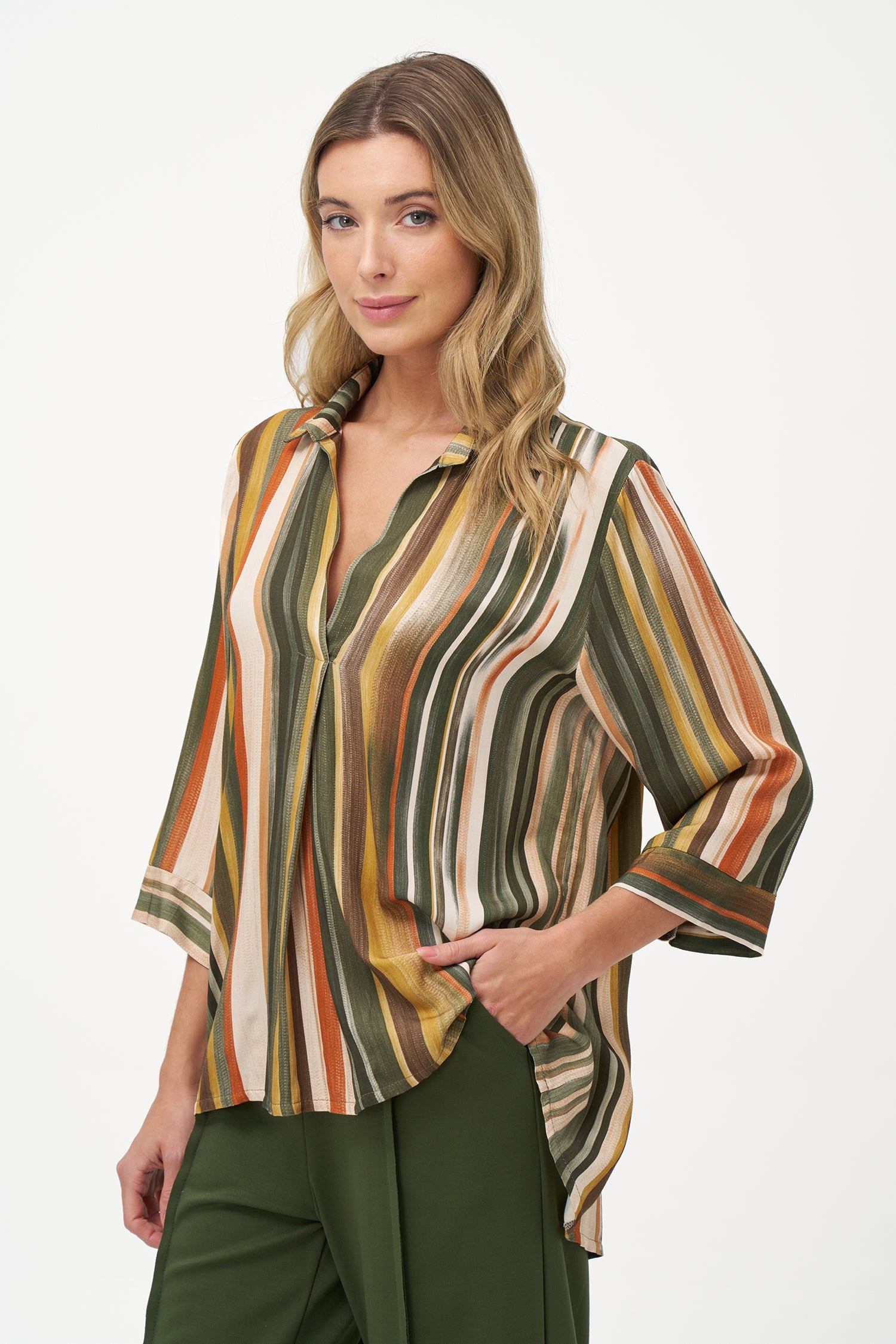 Women’s woven long sleeve v-neck tunic, with a shirt collar and a hi-low hemline