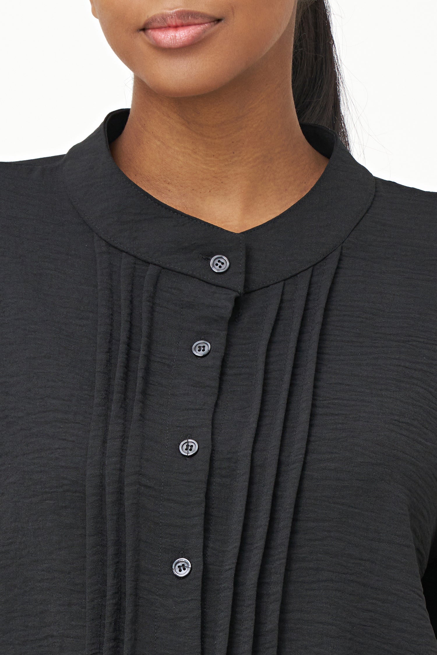 Women's woven button down shirt with a front pin-tuck detailing