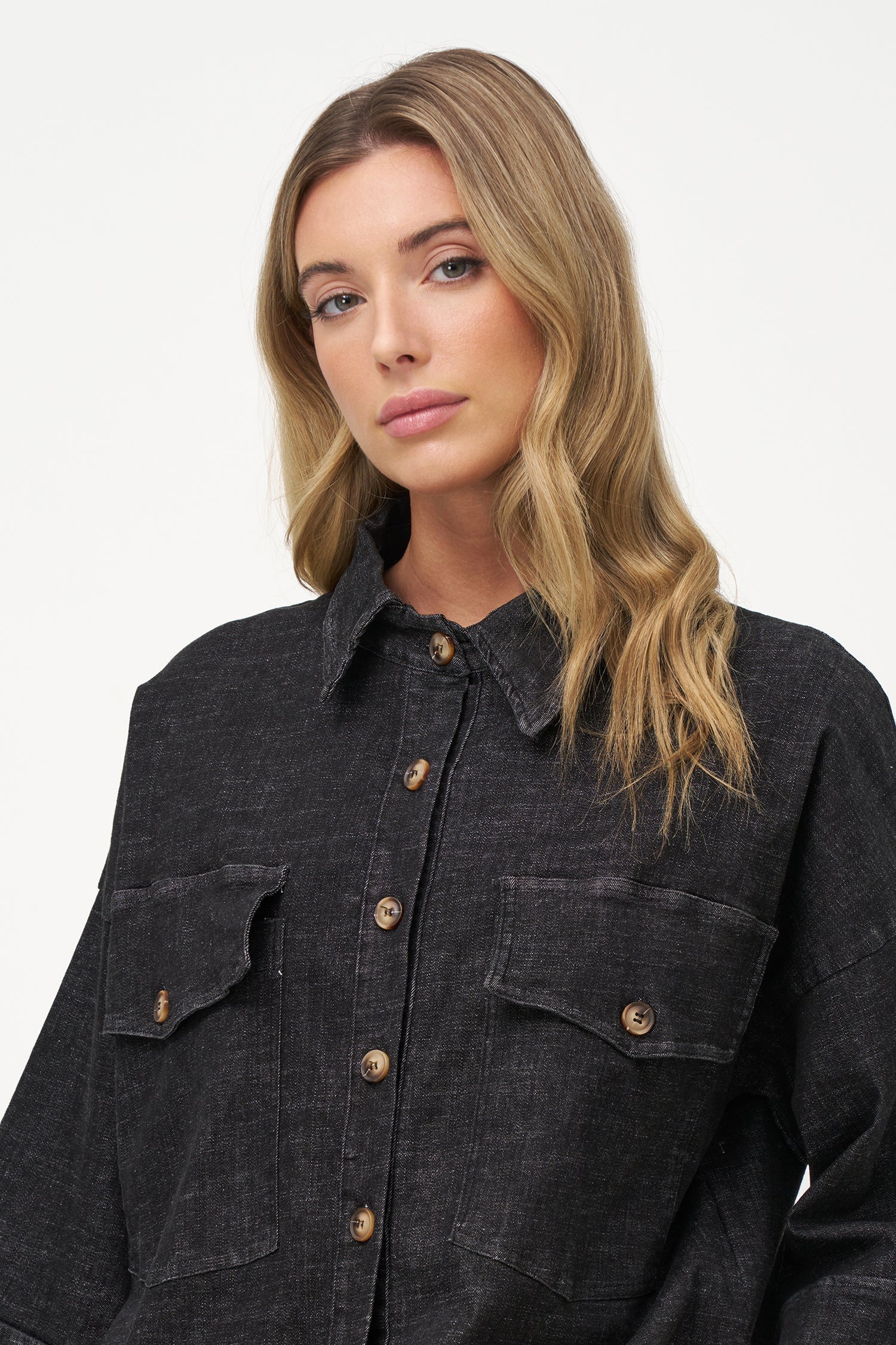 Women's woven denim button-down shirt, with elbow length sleeves and oversized patch pockets