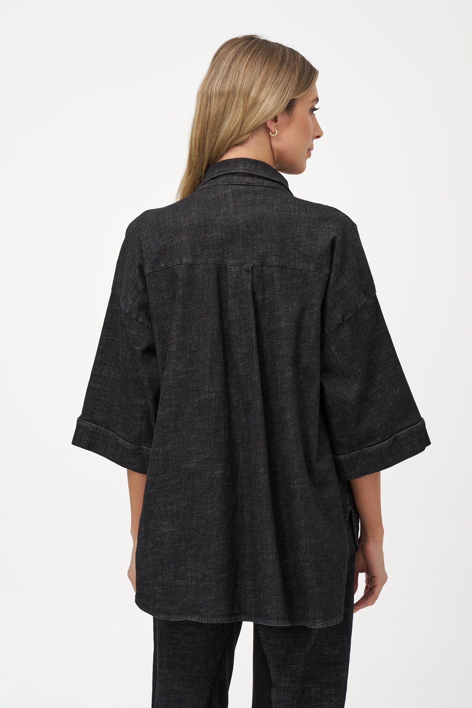 Women's woven denim button-down shirt, with elbow length sleeves and oversized patch pockets
