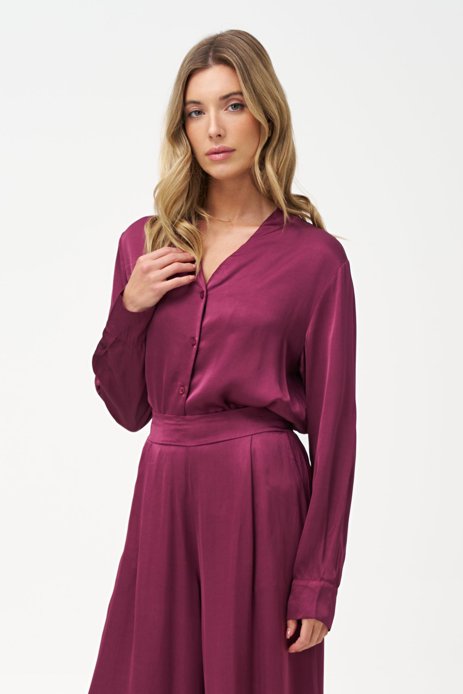 Women’s woven button down shirt, with long sleeves and a v-neckline