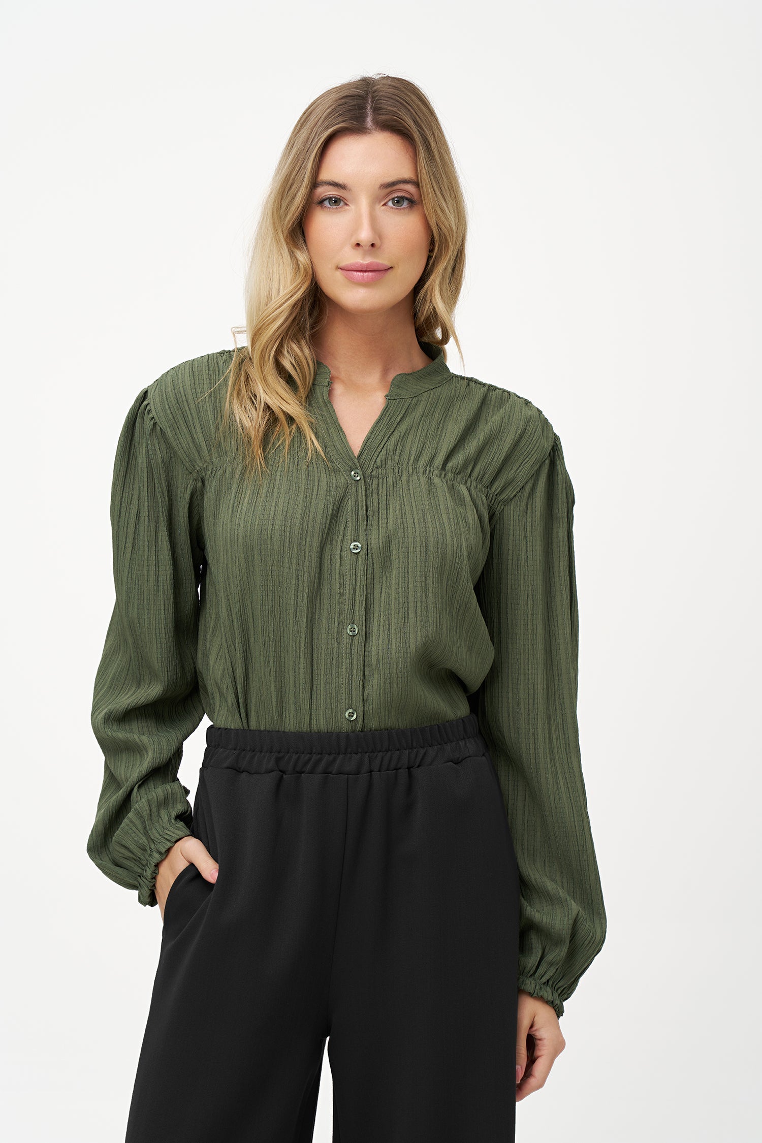 Women's woven button down shirt, with a v-neckline & stand collar, and smocked detailing at the shoulders (front & back)