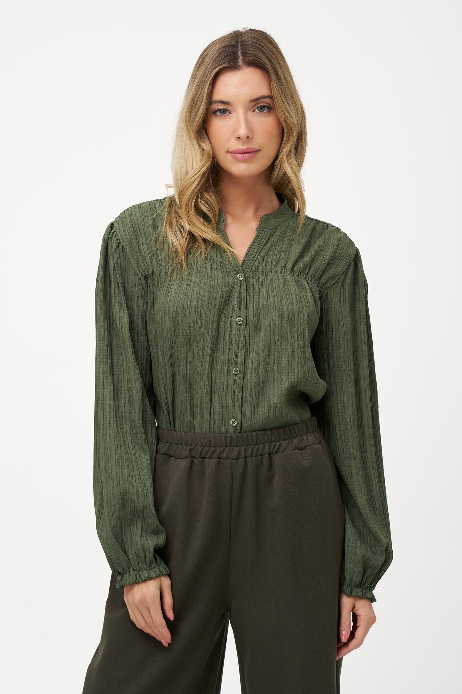 Women's woven button down shirt, with a v-neckline & stand collar, and smocked detailing at the shoulders (front & back)