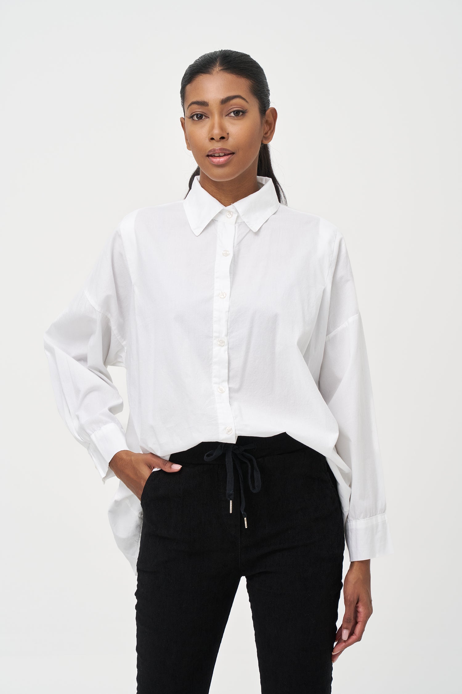 Women's woven button-down long sleeve shirt, with a pleated back detailing