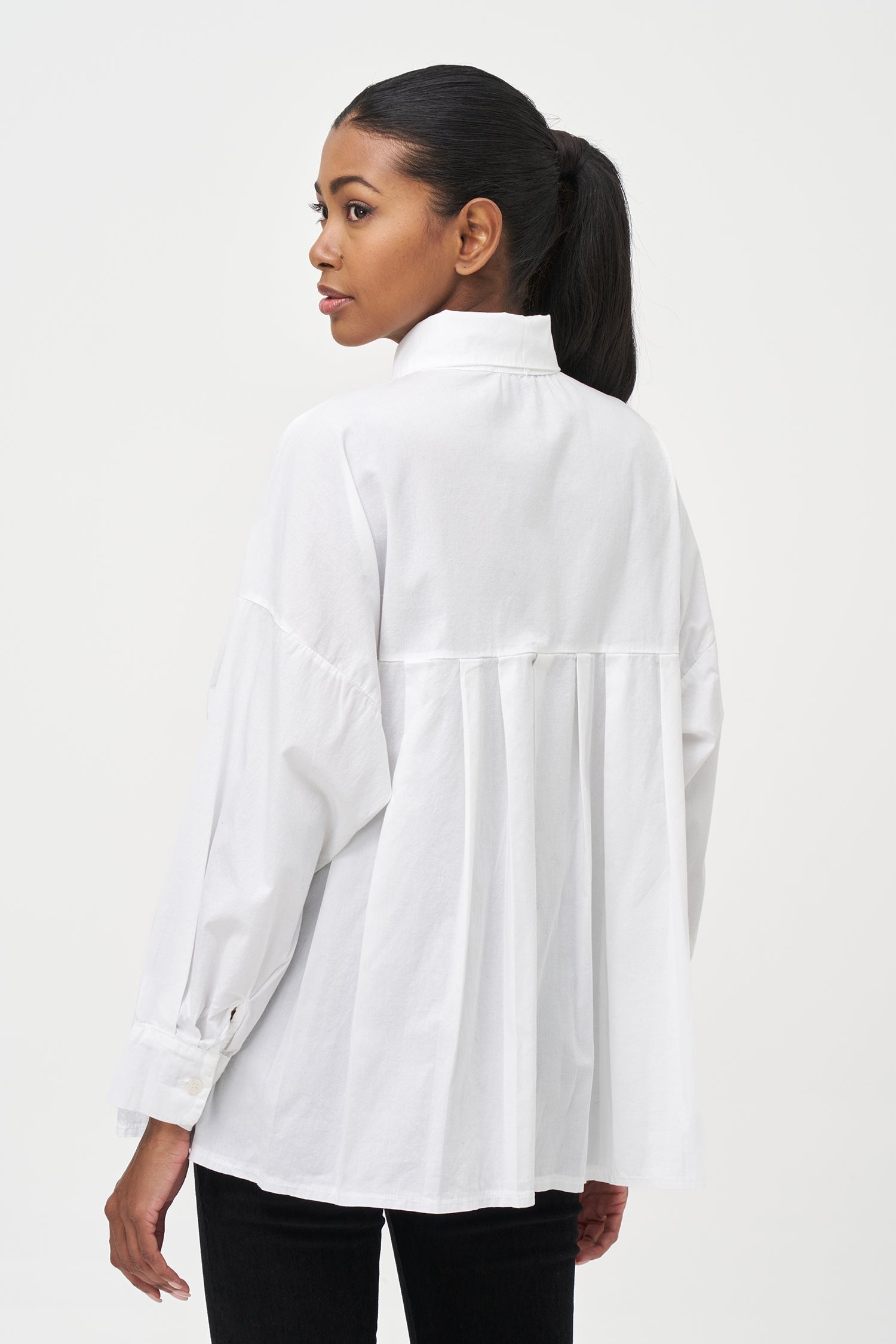 Women's woven button-down long sleeve shirt, with a pleated back detailing