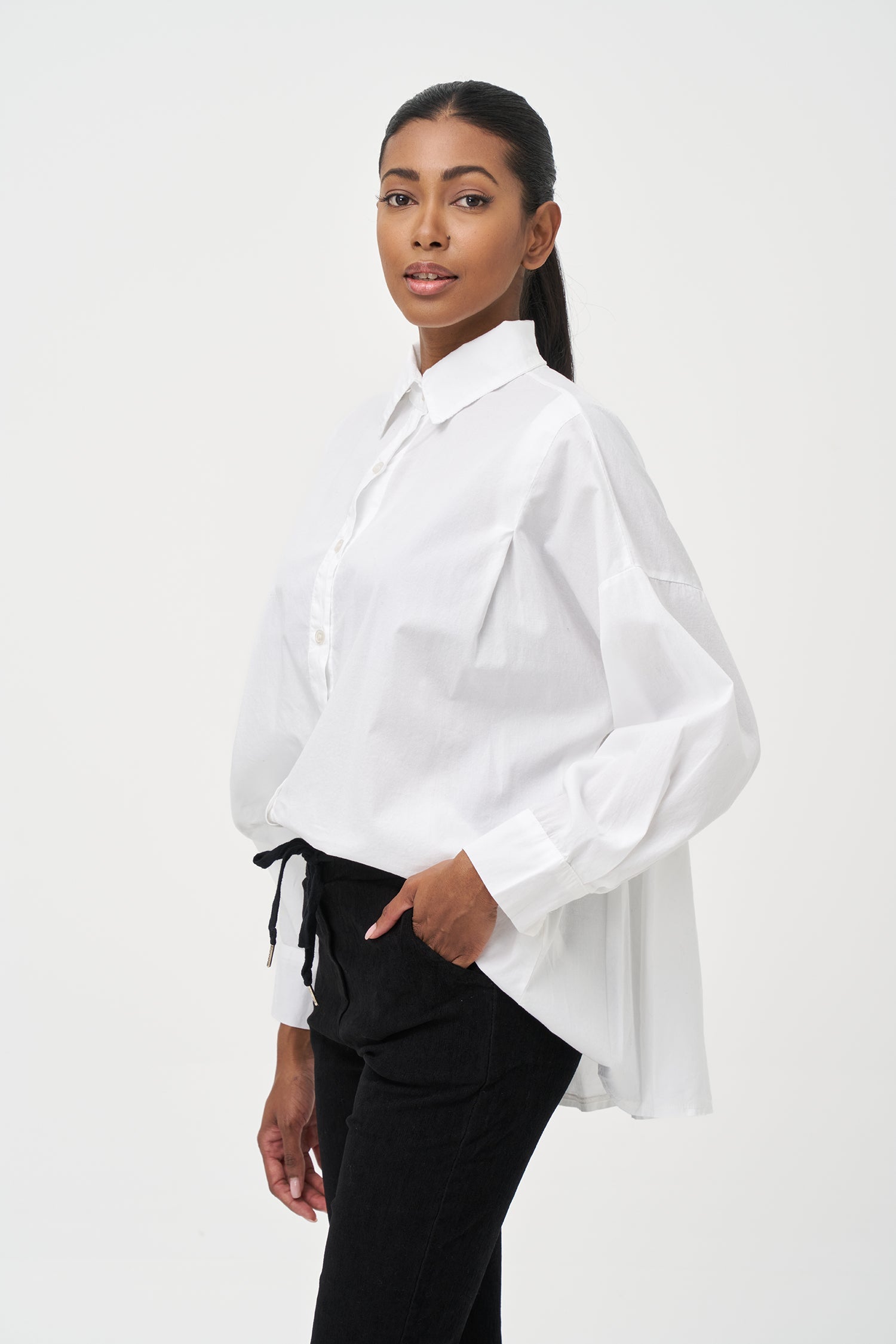 Women's woven button-down long sleeve shirt, with a pleated back detailing