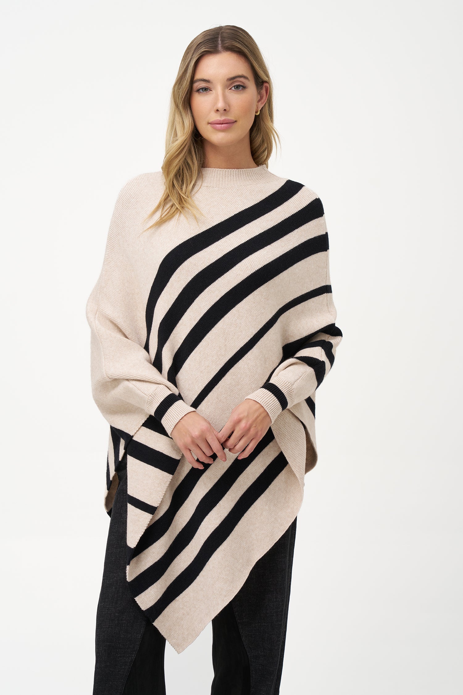 Women’s knit striped mock-neck poncho with a pointed hemline and wrist cuffs