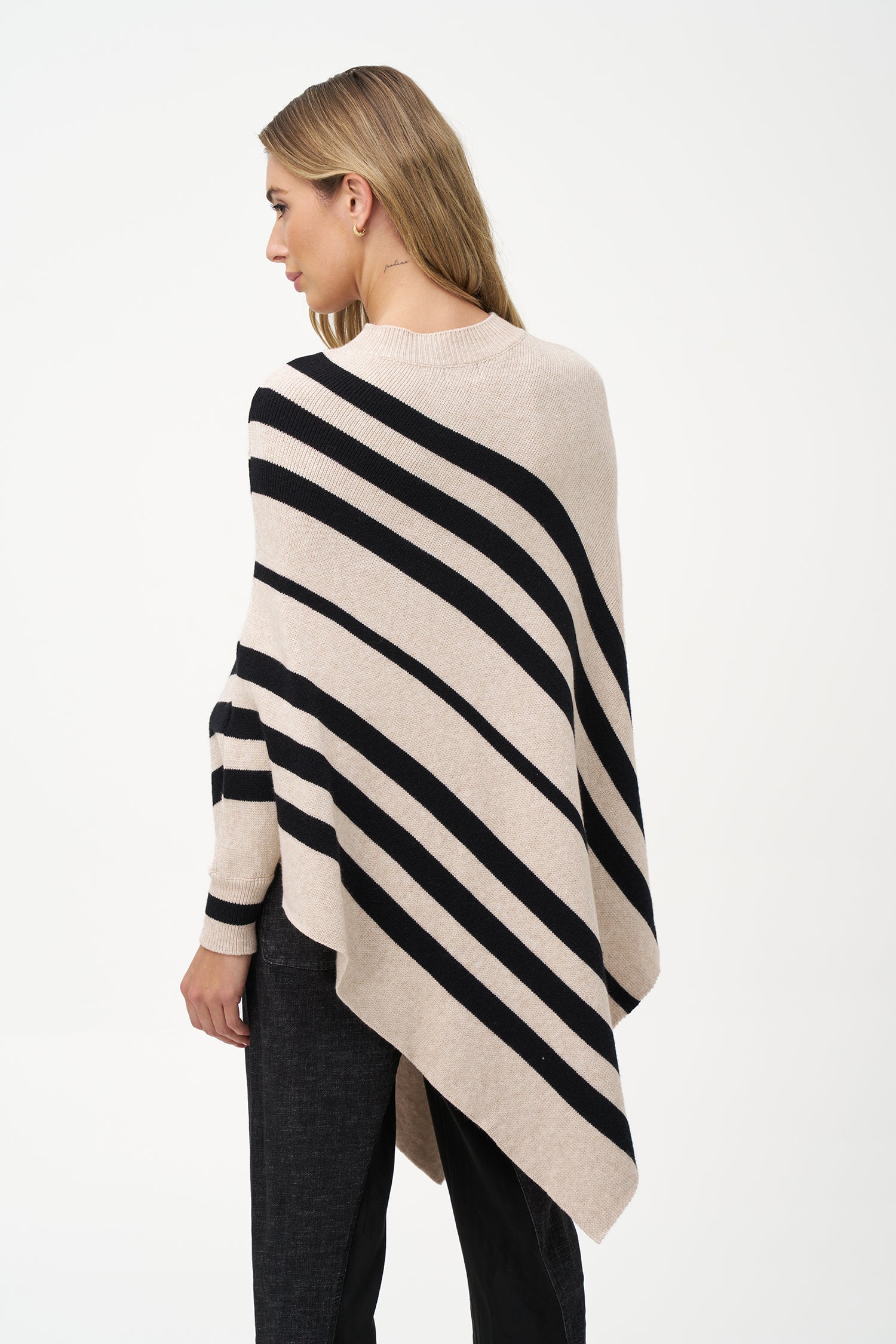 Women’s knit striped mock-neck poncho with a pointed hemline and wrist cuffs