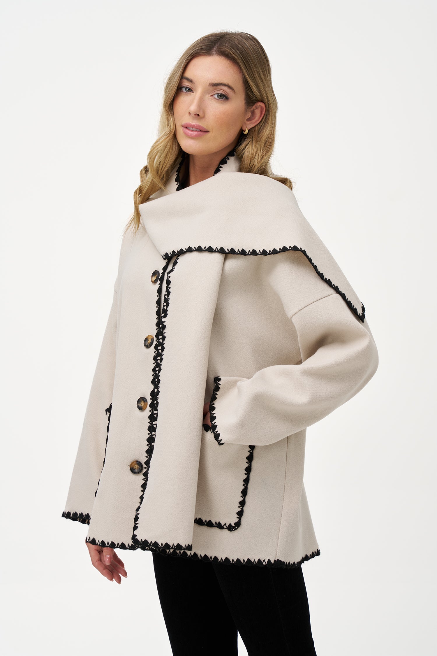 Women's woven button-down hip-length coat, with decorative stitching, patch pockets, and a usable attached scarf