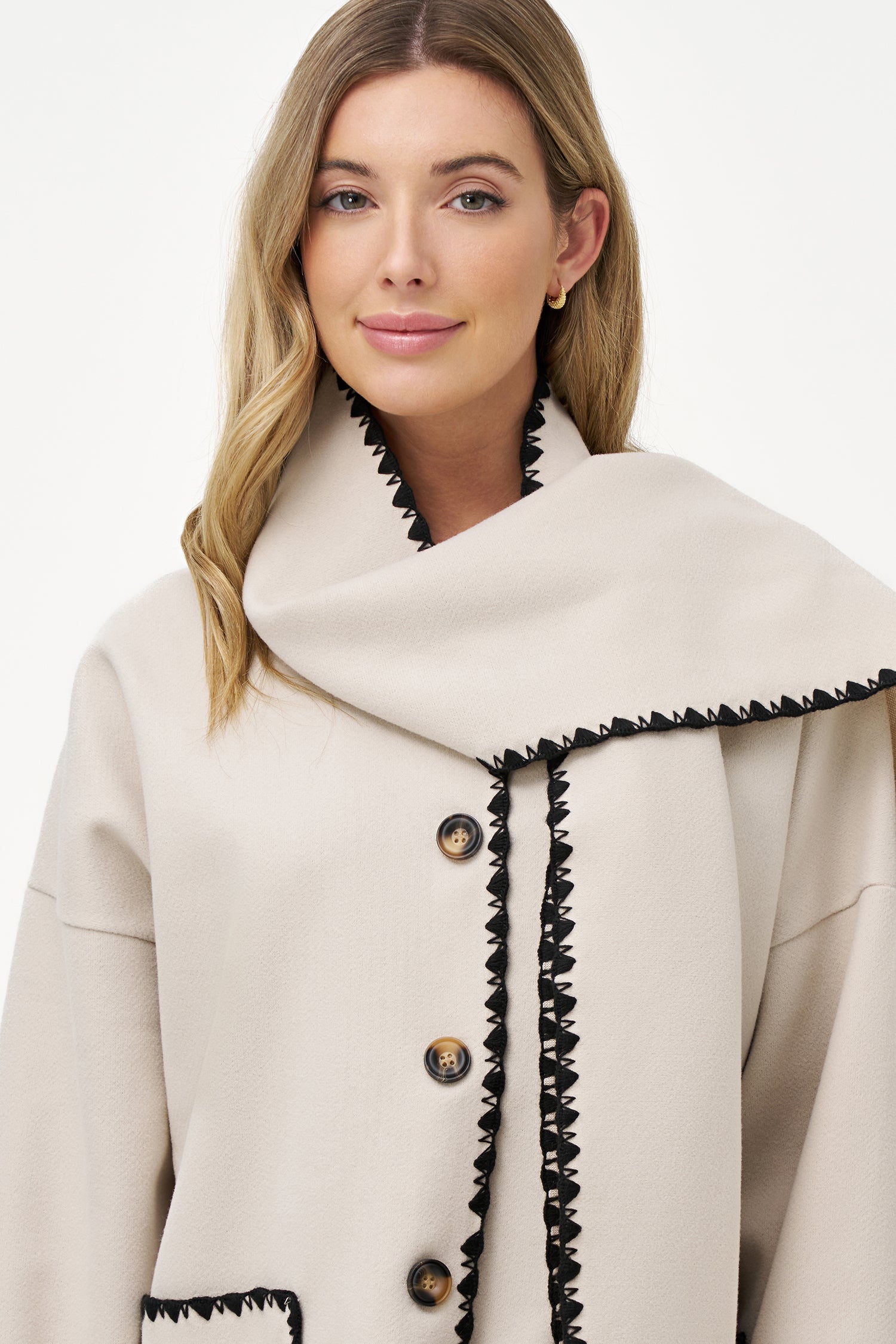 Women's woven button-down hip-length coat, with decorative stitching, patch pockets, and a usable attached scarf