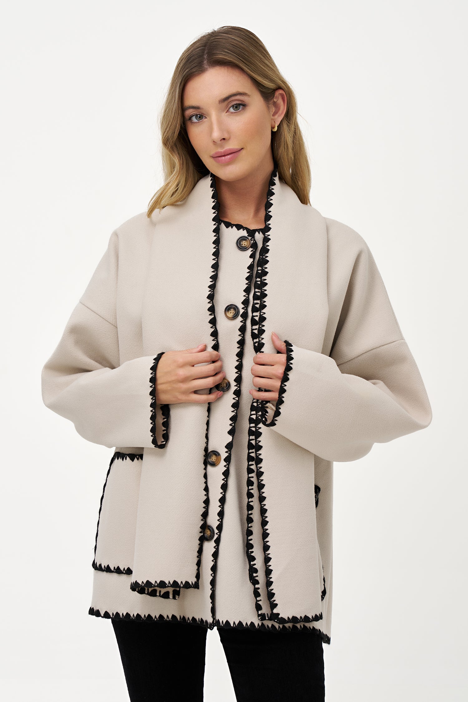 Women's woven button-down hip-length coat, with decorative stitching, patch pockets, and a usable attached scarf