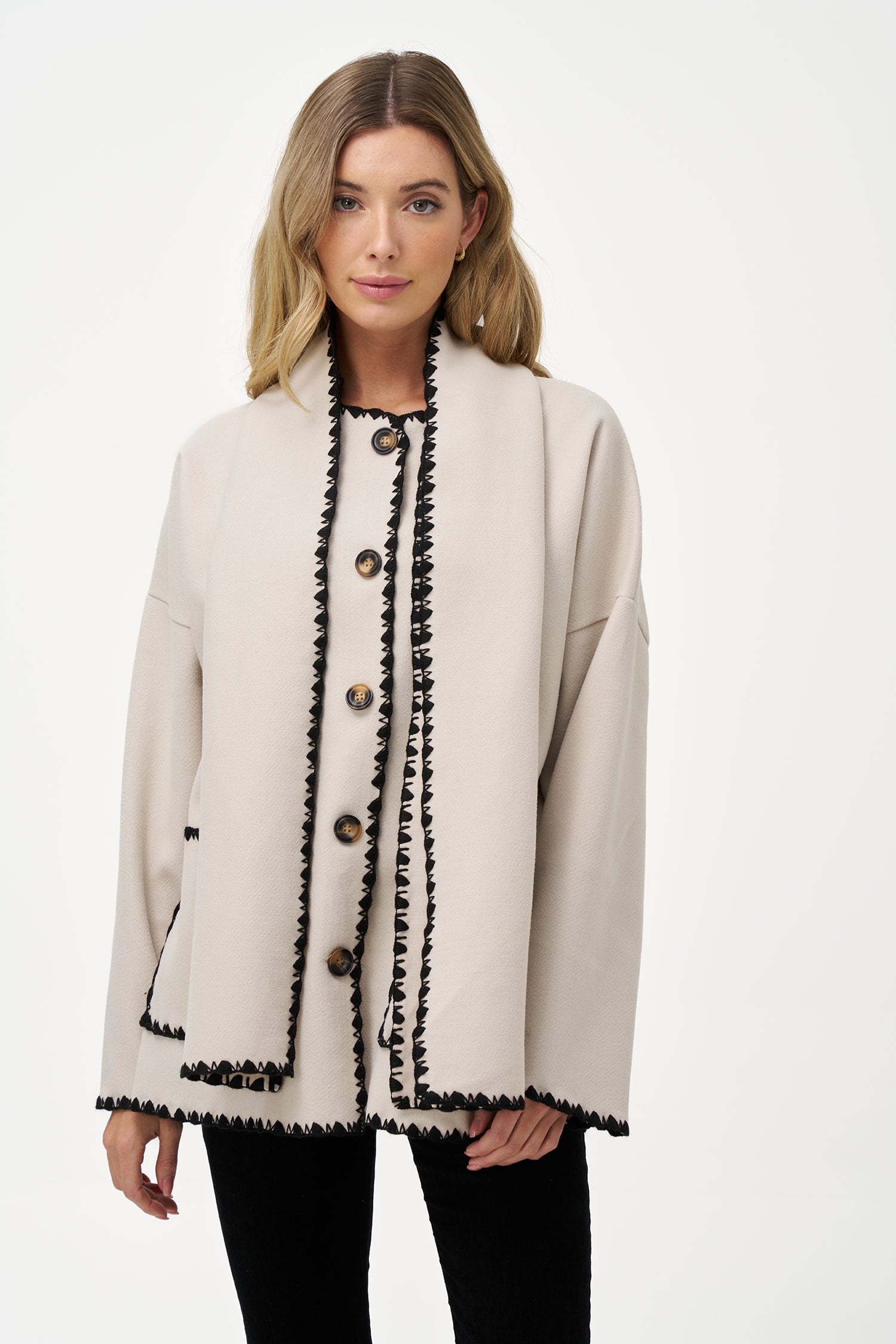 Women's woven button-down hip-length coat, with decorative stitching, patch pockets, and a usable attached scarf