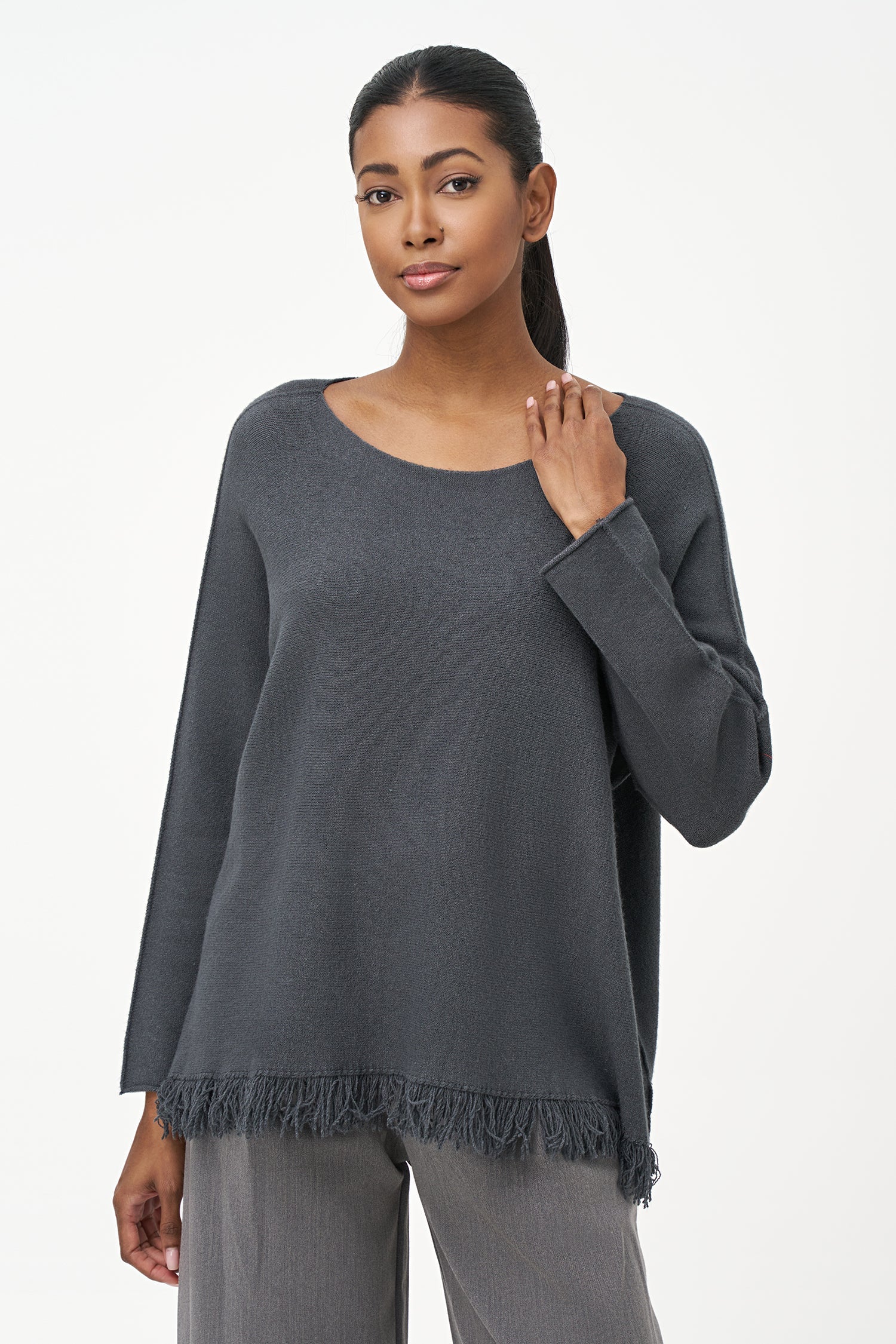 Women’s boat-neck long sleeve sweater, with fringe detailing at the hemline