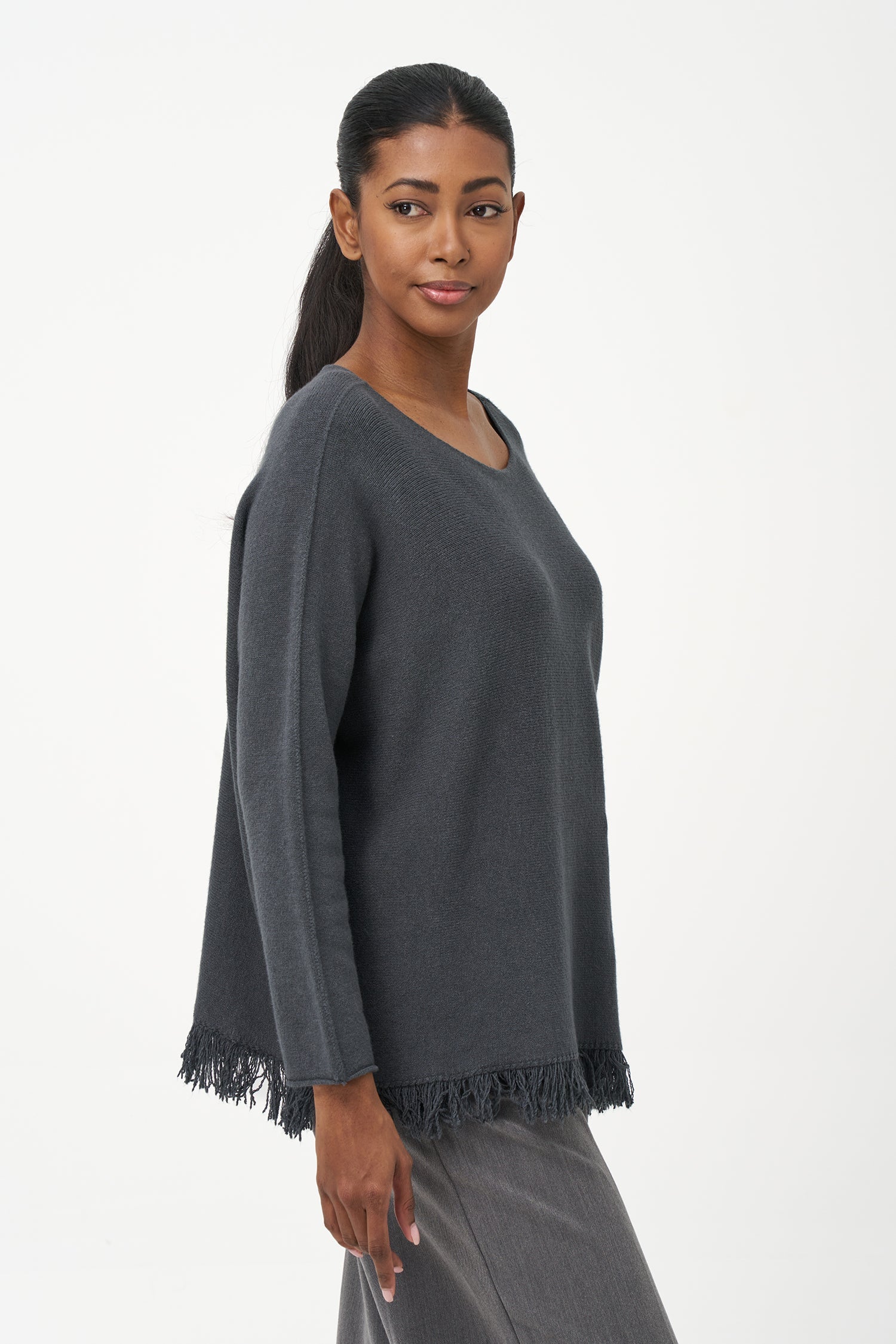Women’s boat-neck long sleeve sweater, with fringe detailing at the hemline