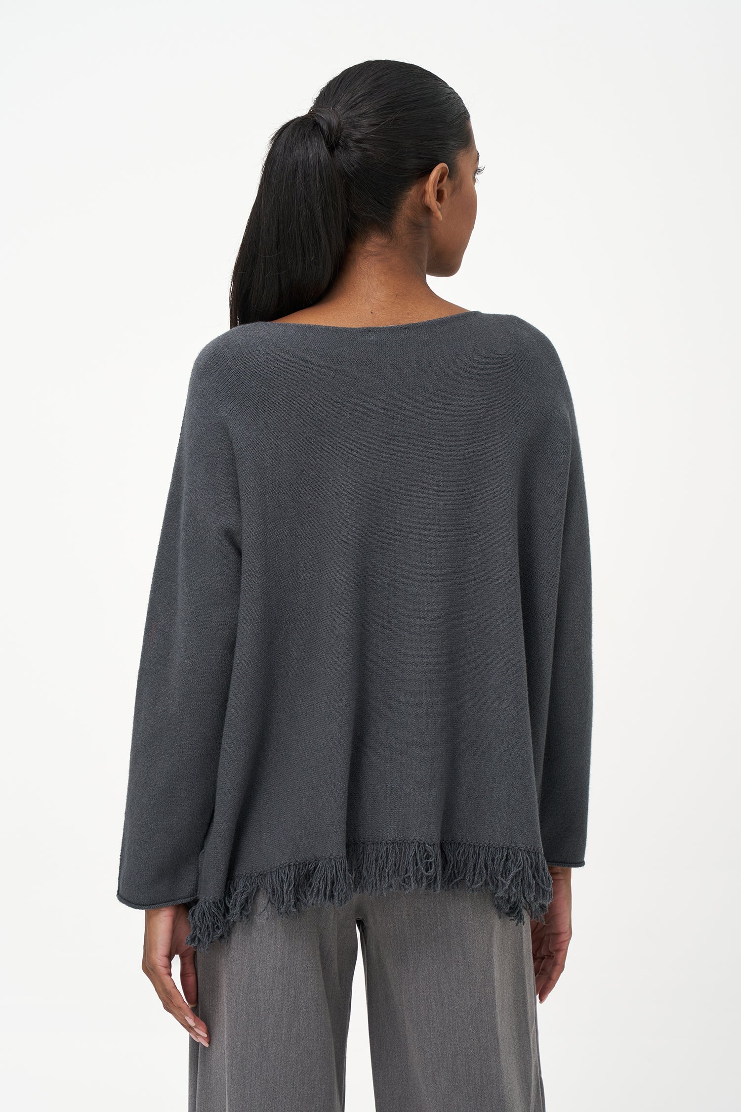 Women’s boat-neck long sleeve sweater, with fringe detailing at the hemline