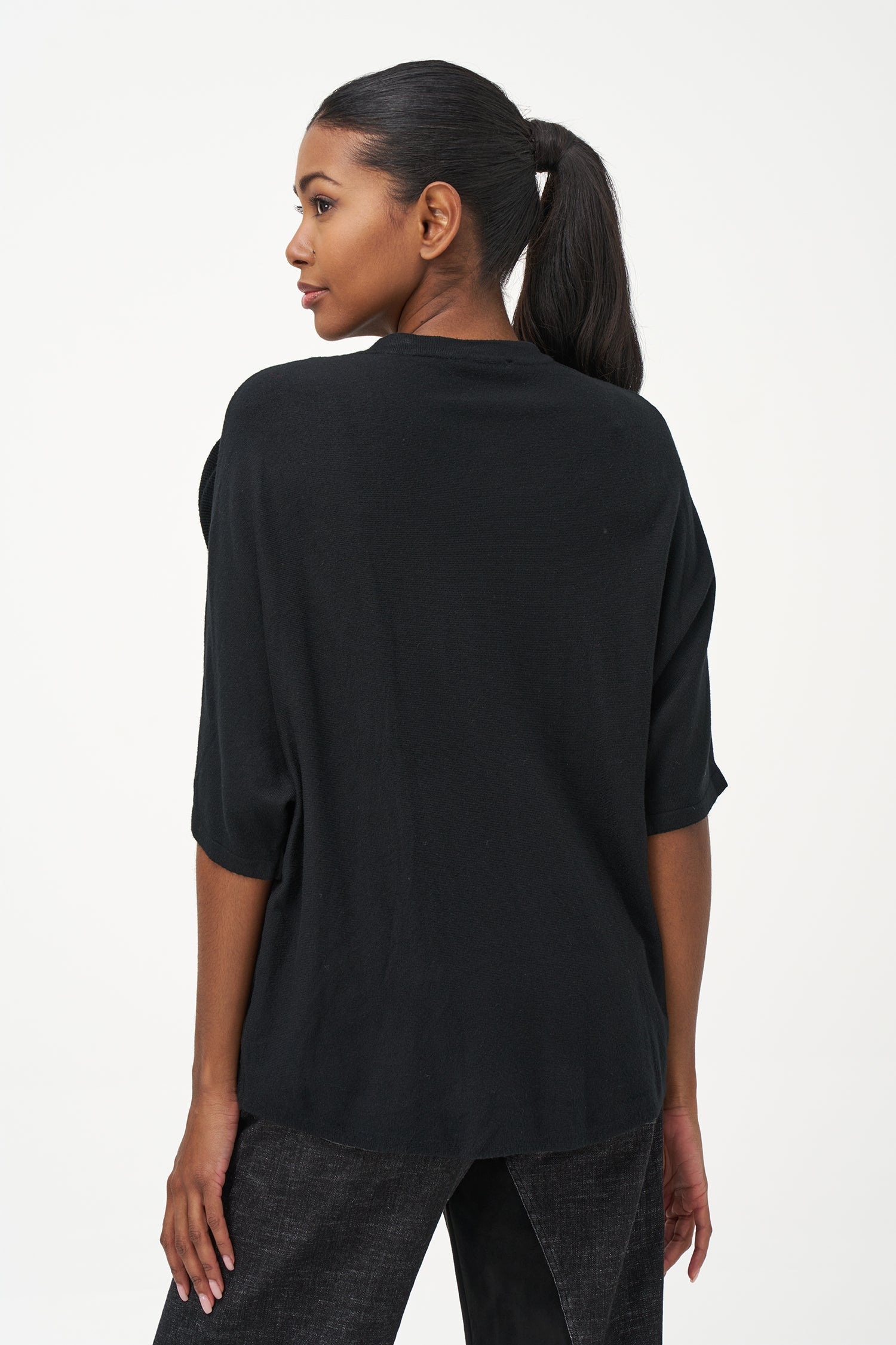 Women's knit short sleeve crew-neck sweater, with an attached flower detail