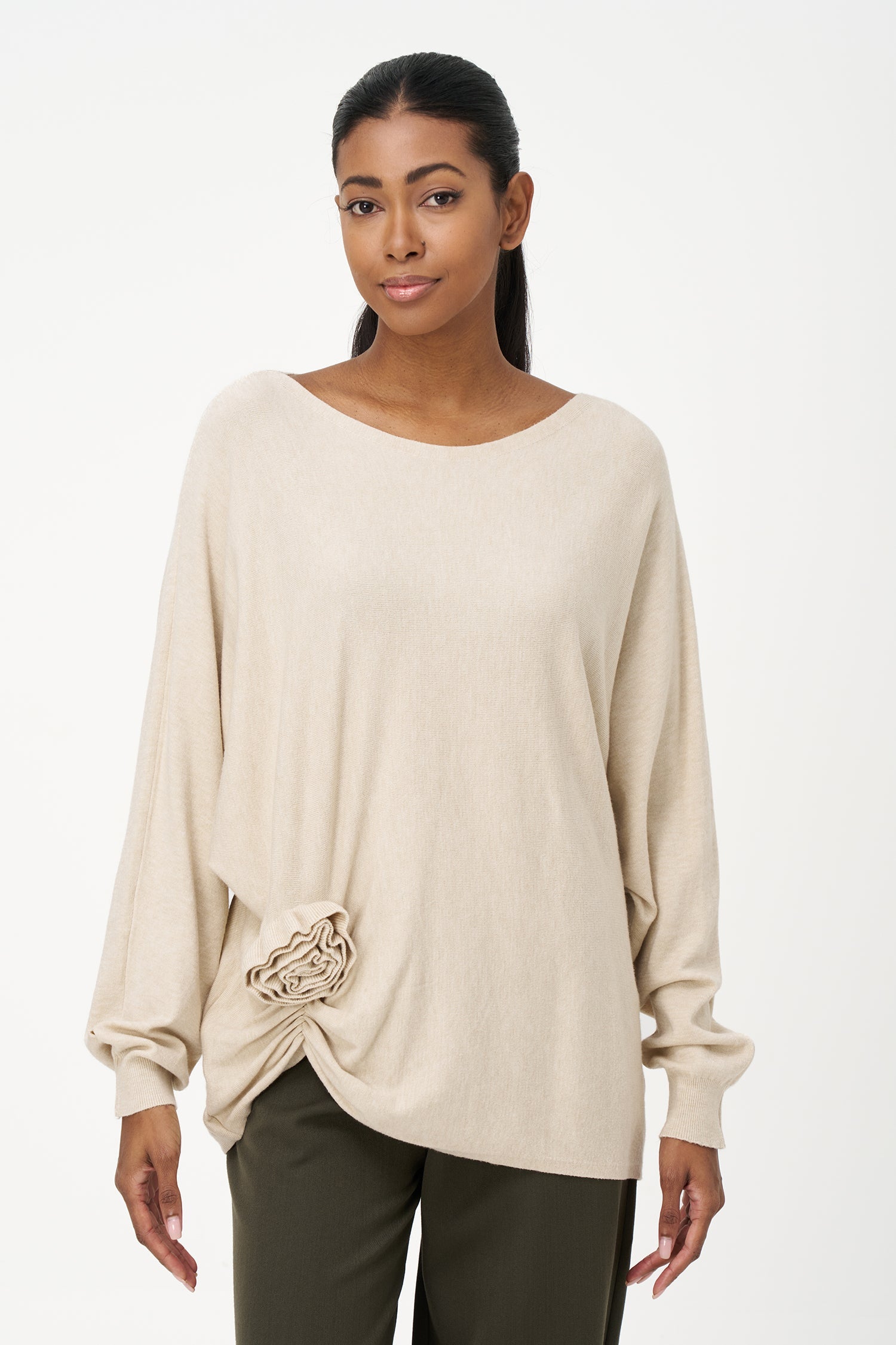 Women's knit long sleeve wide-neck sweater, with an attached flower detail