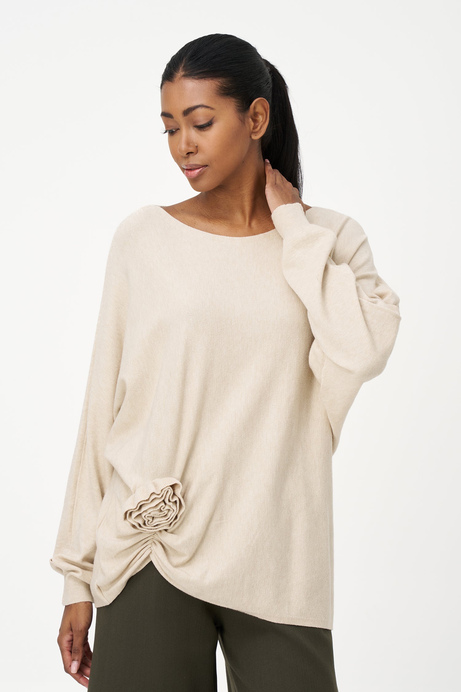 Women's knit long sleeve wide-neck sweater, with an attached flower detail