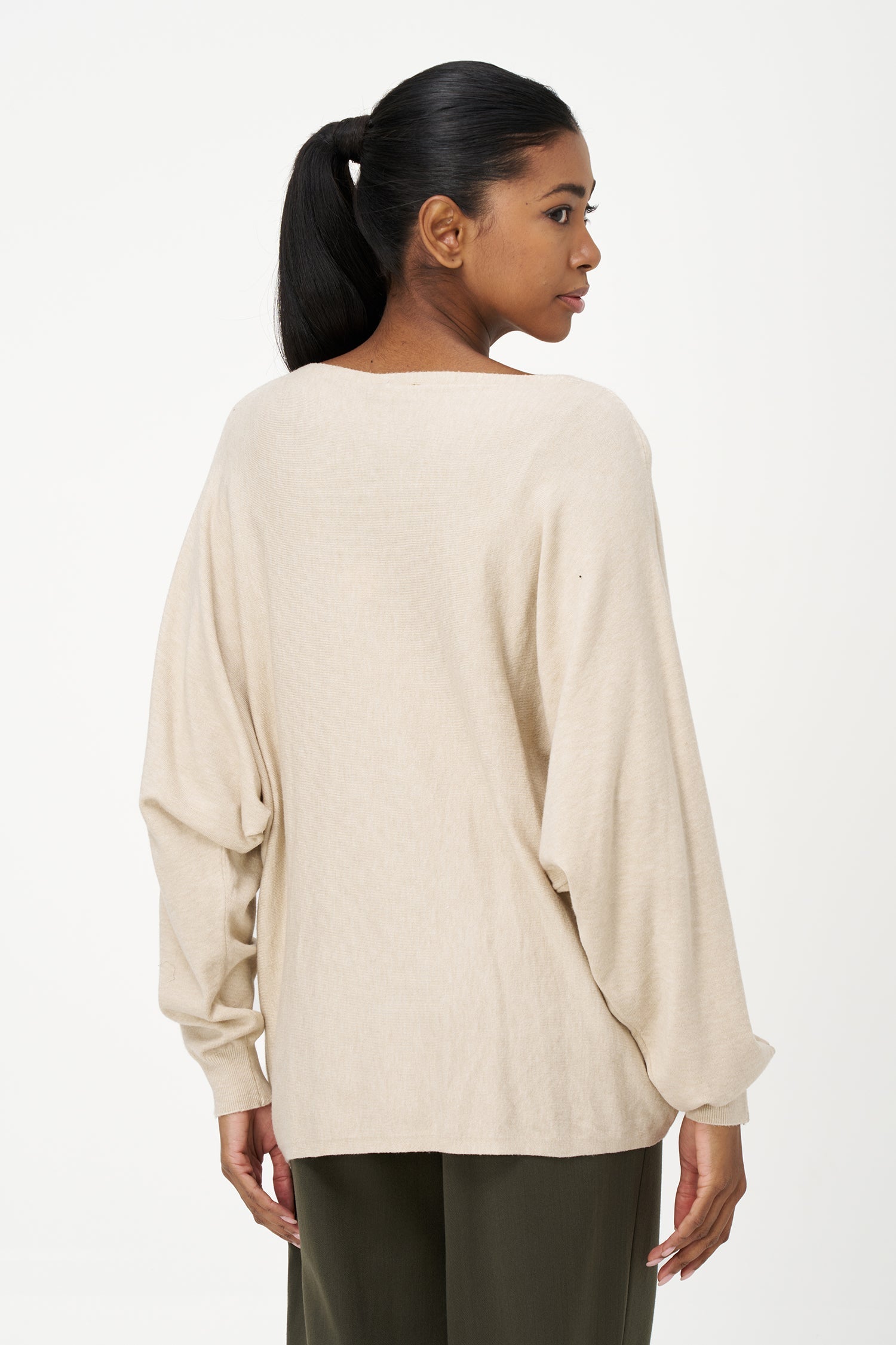 Women's knit long sleeve wide-neck sweater, with an attached flower detail