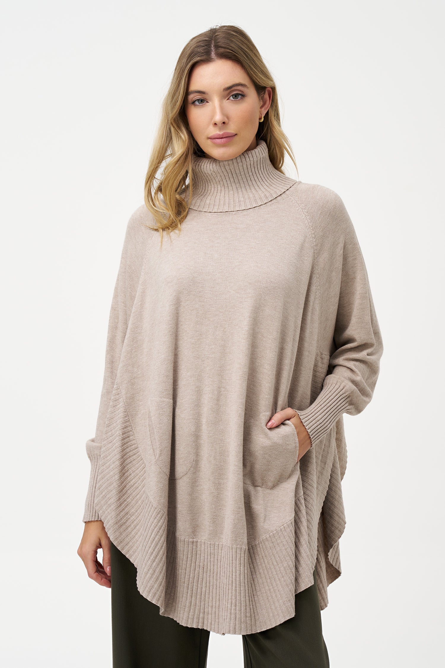 Women's knit oversized turtle-neck long sleeve sweater, with a scooped hemline