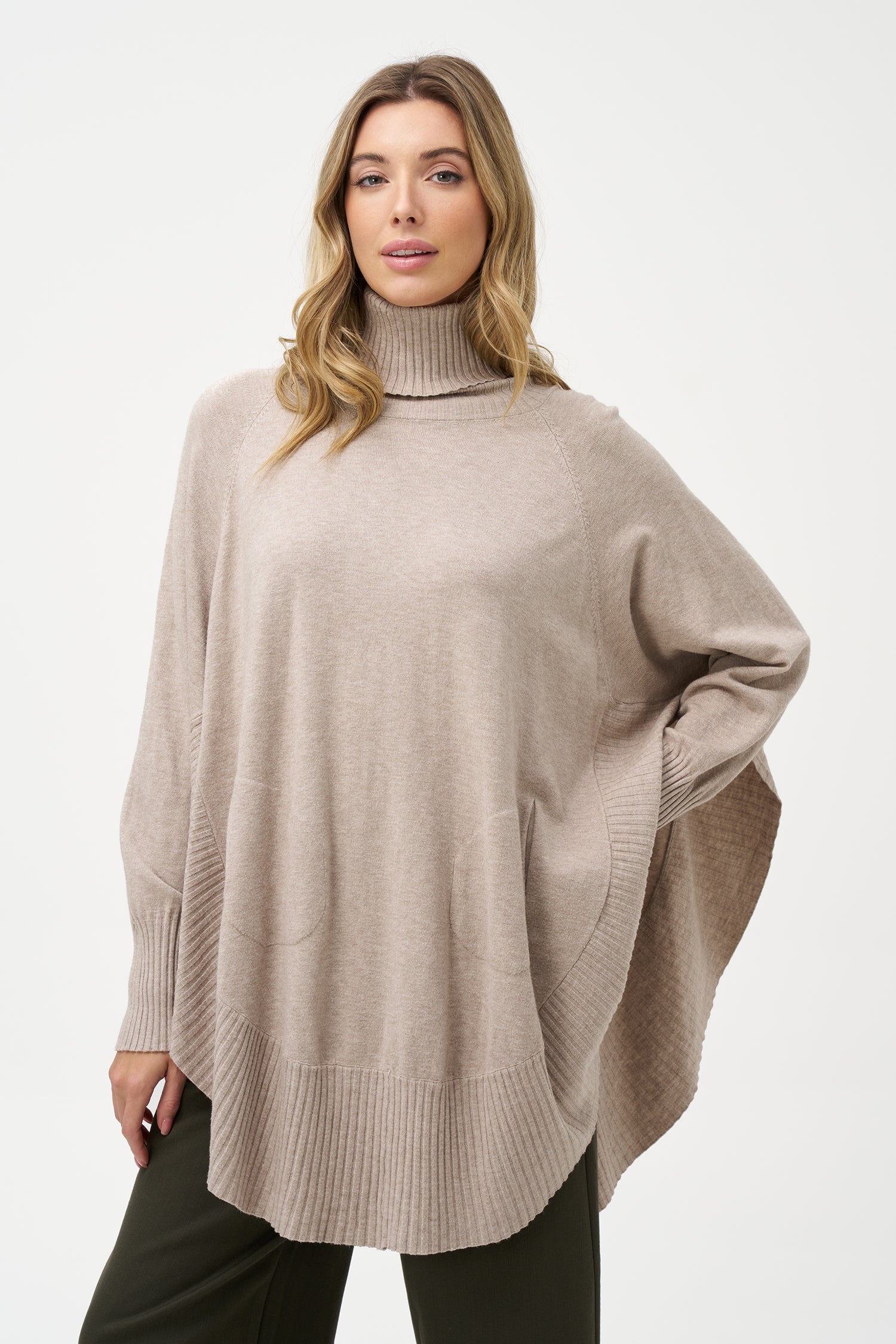 Women's knit oversized turtle-neck long sleeve sweater, with a scooped hemline