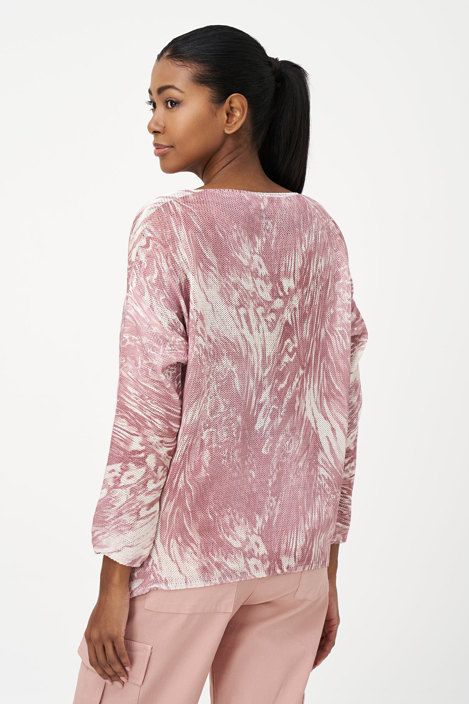 Women's knit boat-neck sweater, with long sleeves and a shark-bite hemline