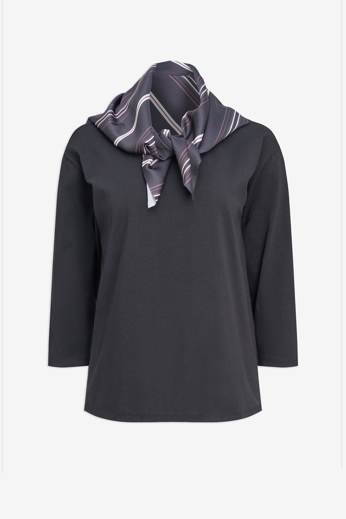 A dark charcoal gray long-sleeve top with a patterned scarf in gray, white, and black draped around the neck, shown against a plain light gray background.