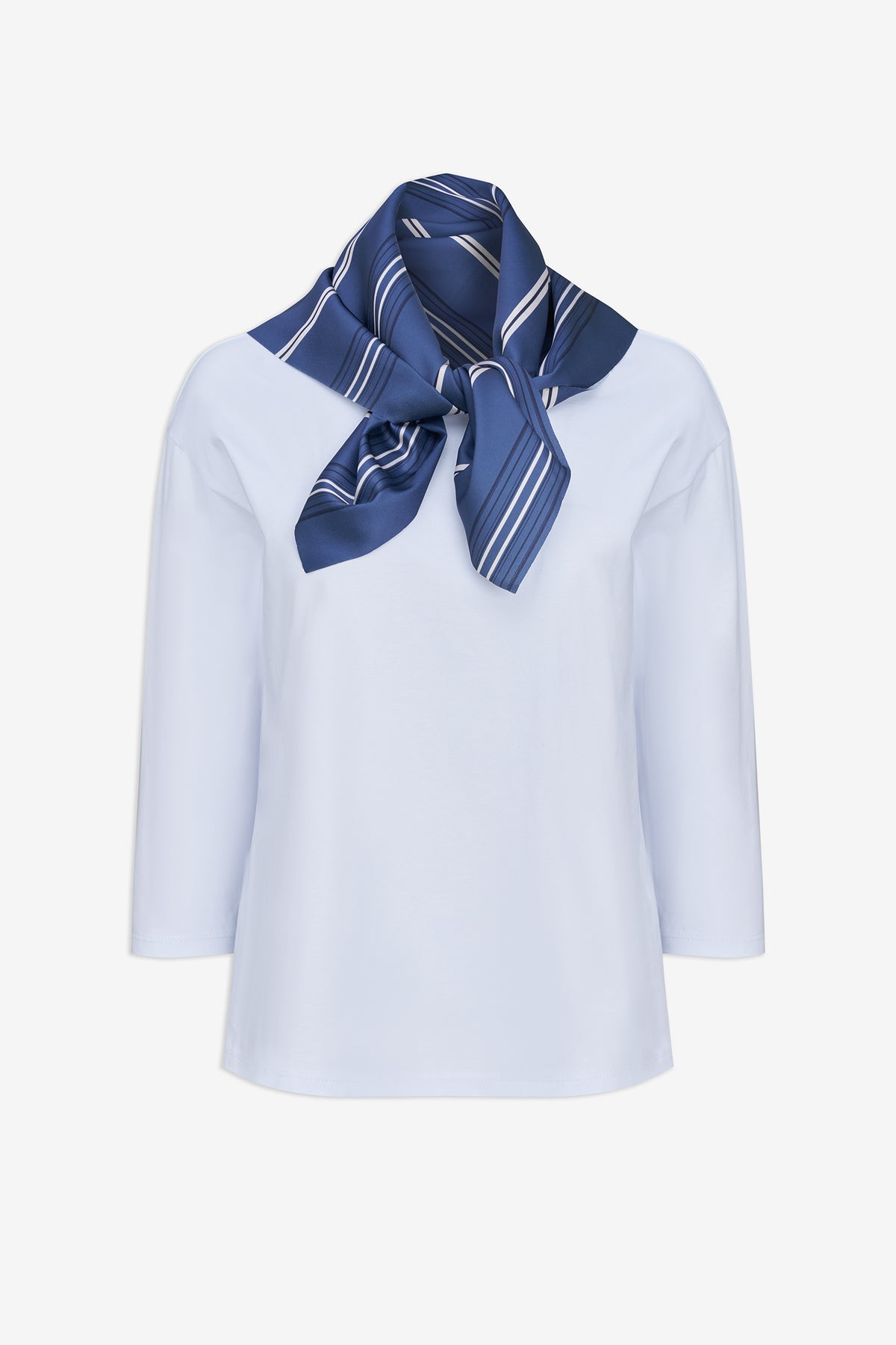 A white long-sleeve blouse with a navy blue striped silk neck scarf tied around the collar, displayed on a clean white background.