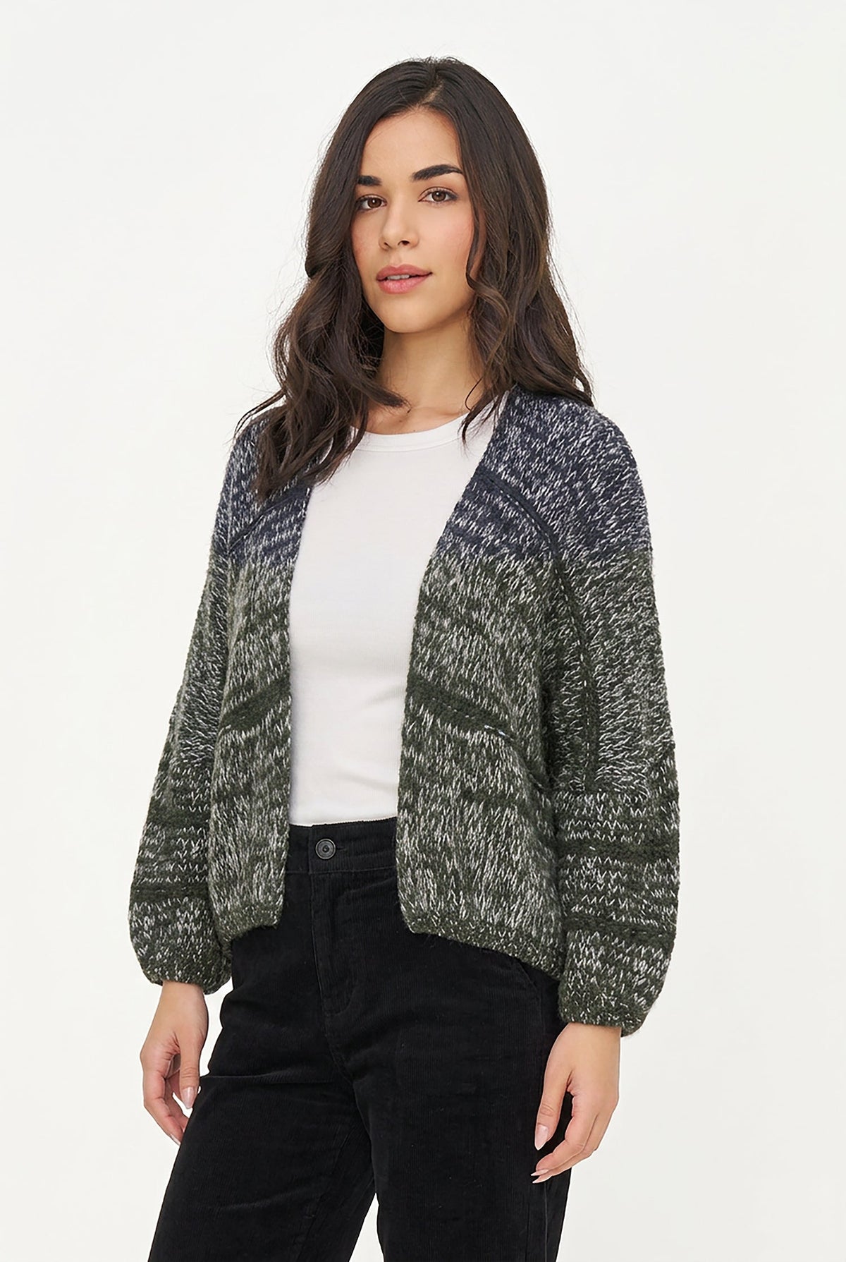 A woman modeling a marled knit cardigan with a color gradient from dark gray and black at the top to olive green and gray at the bottom, worn over a white top and black pants against a plain white background.