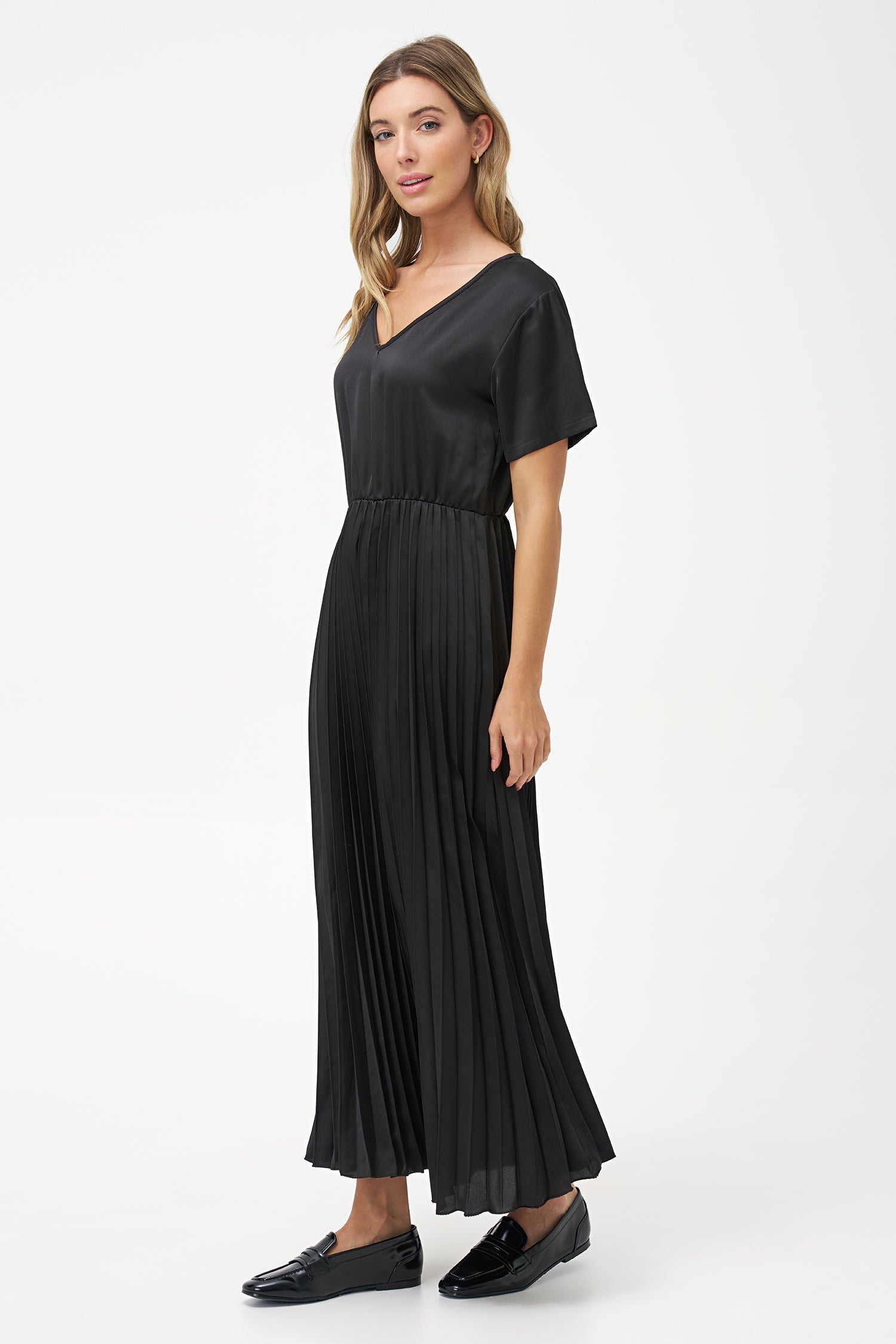 Women’s woven v-neckline short sleeve dress. a plain top half with a pleated bottom half