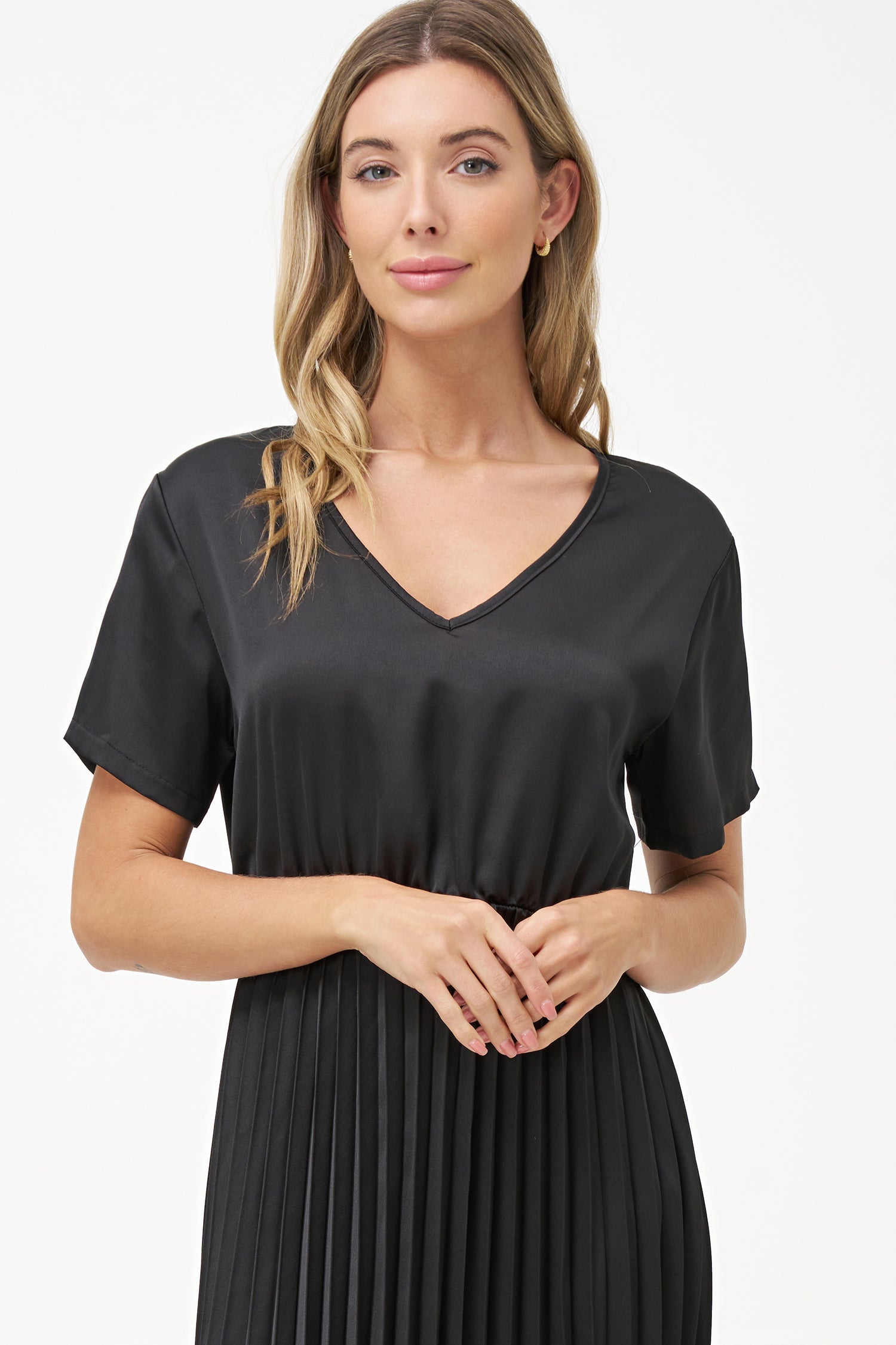 Women’s woven v-neckline short sleeve dress. a plain top half with a pleated bottom half